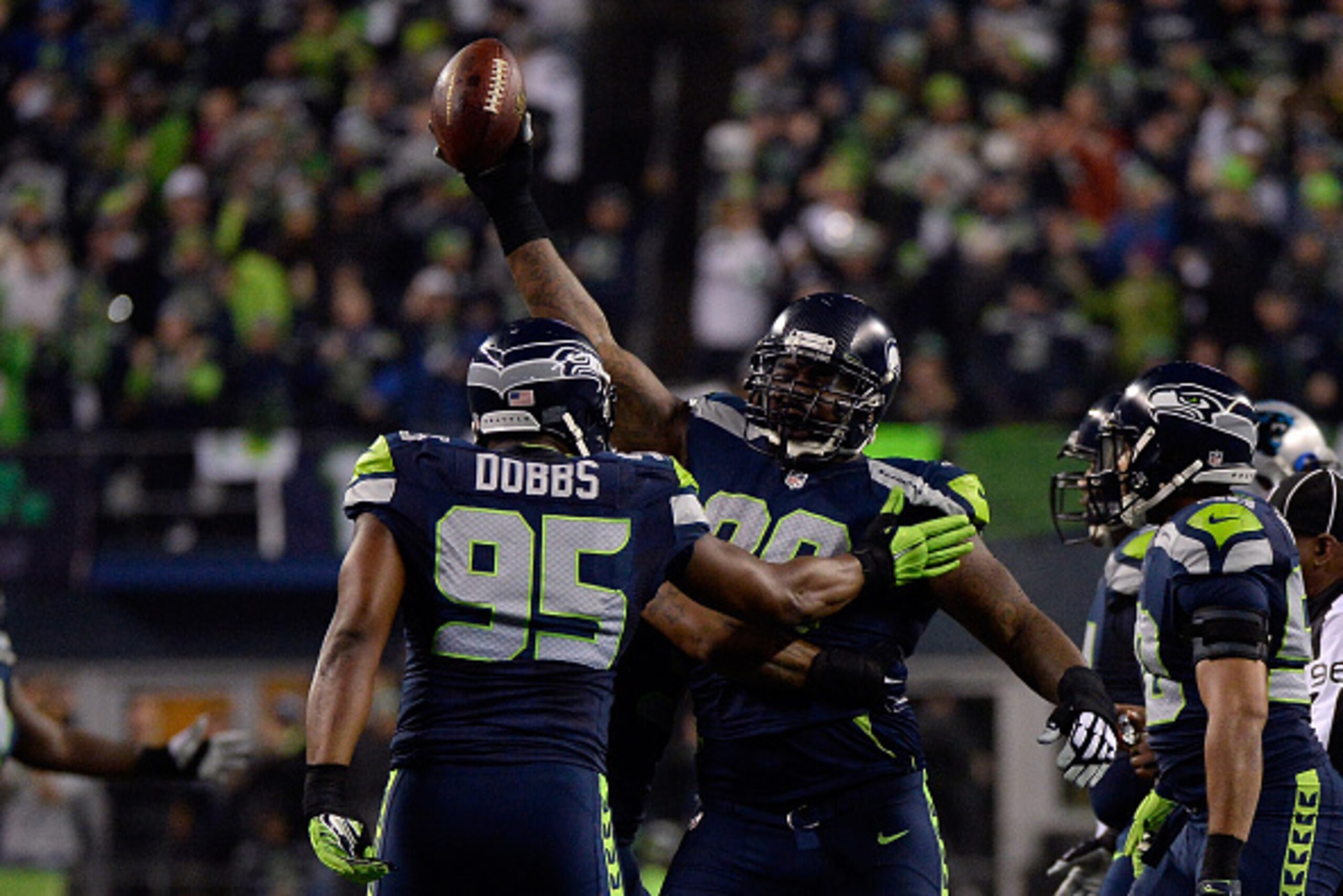 SEATTLE, WA - JANUARY 10:  Tony McDaniel #99 of the Seattle Seahawks celebrates after recovering a fumble in the first half against the Carolina Panthers during the 2015 NFC Divisional Playoff game at CenturyLink Field on January 10, 2015 in Seattle, Wash
