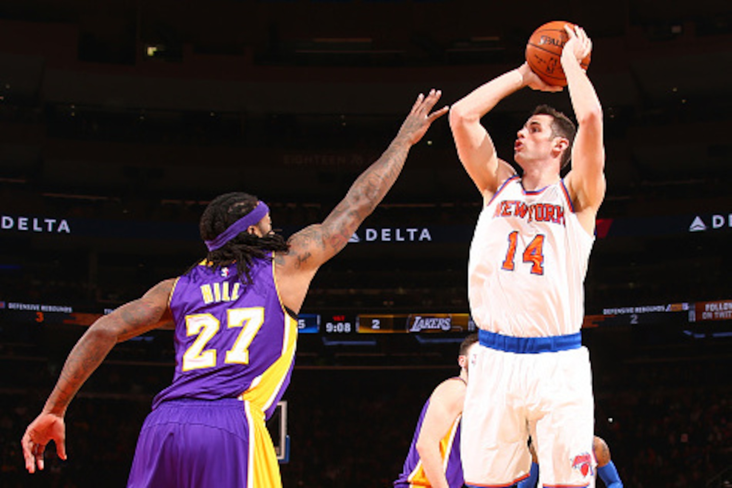 NEW YORK, NY -  FEBRUARY 2: Jason Smith #14 of the New York Knicks shoots against Jordan Hill #27 of the Los Angeles Lakers during the game on February 2, 2015 at Madison Square Garden in New York, New York . NOTE TO USER: User expressly acknowledges and 