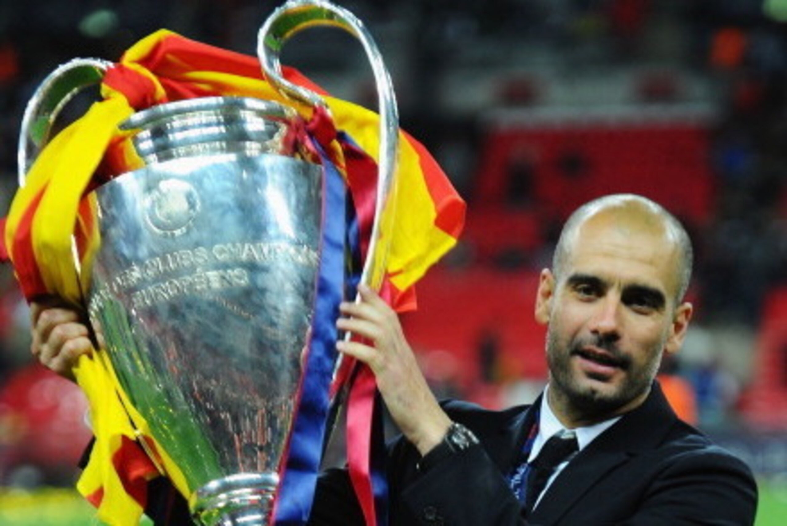 LONDON, ENGLAND - MAY 28:  Josep Guardiola manager of FC Barcelona lifts the trophy after victory in the UEFA Champions League final between FC Barcelona and Manchester United FC at Wembley Stadium on May 28, 2011 in London, England.  (Photo by Clive Maso