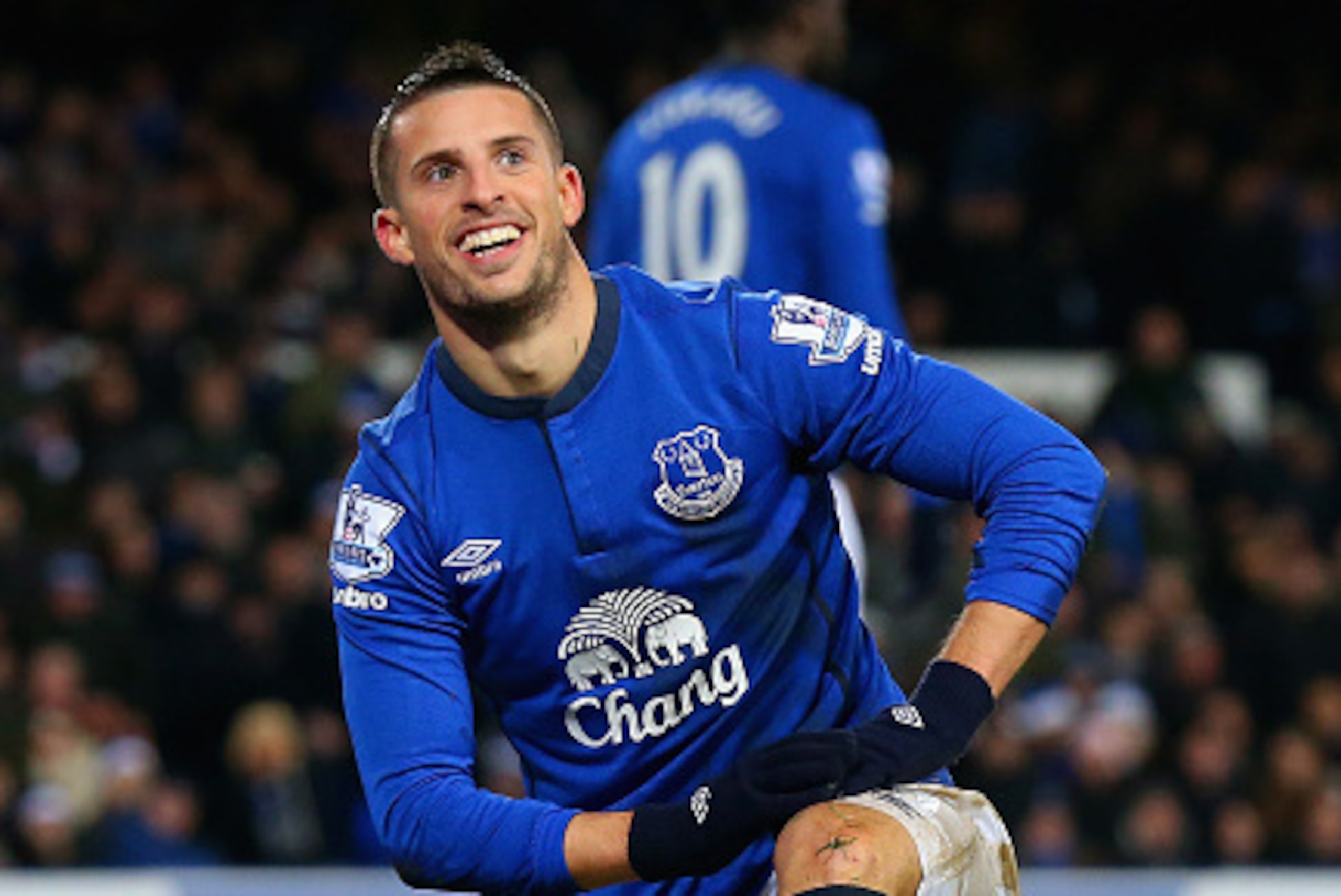 LIVERPOOL, ENGLAND - DECEMBER 15:  Kevin Mirallas of Everton smiles as no foul was given after going down in the area under pressure from Richard Dunne of QPR during the Barclays Premier League match between Everton and Queens Park Rangers at Goodison Par