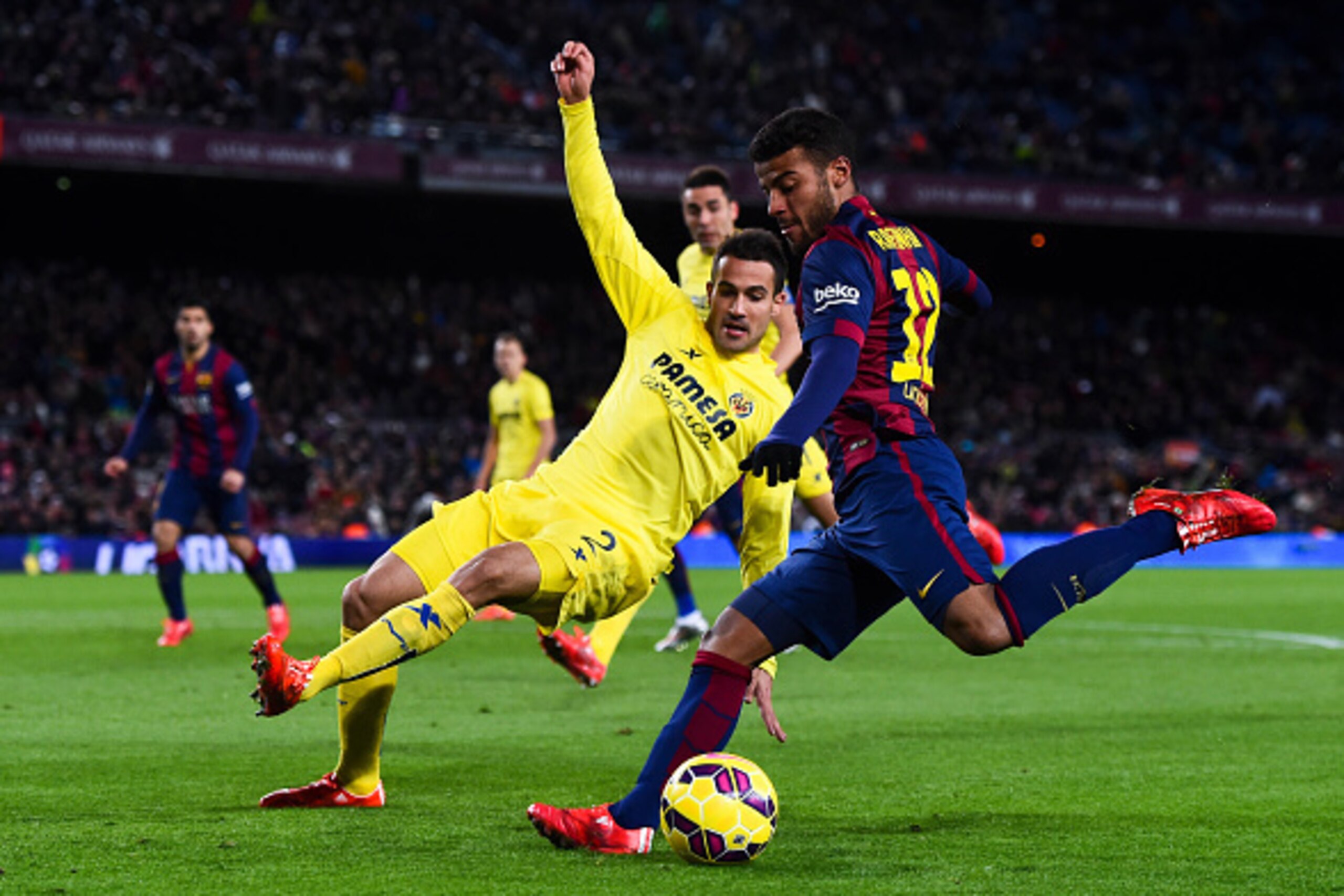 BARCELONA, SPAIN - FEBRUARY 01:  Rafinha of FC Barcelona competes for the ball with Mario Gaspar of Villarreal CF during the La Liga match between FC Barcelona and Villarreal CF at Camp Nou on February 1, 2015 in Barcelona, Spain.  (Photo by David Ramos/G