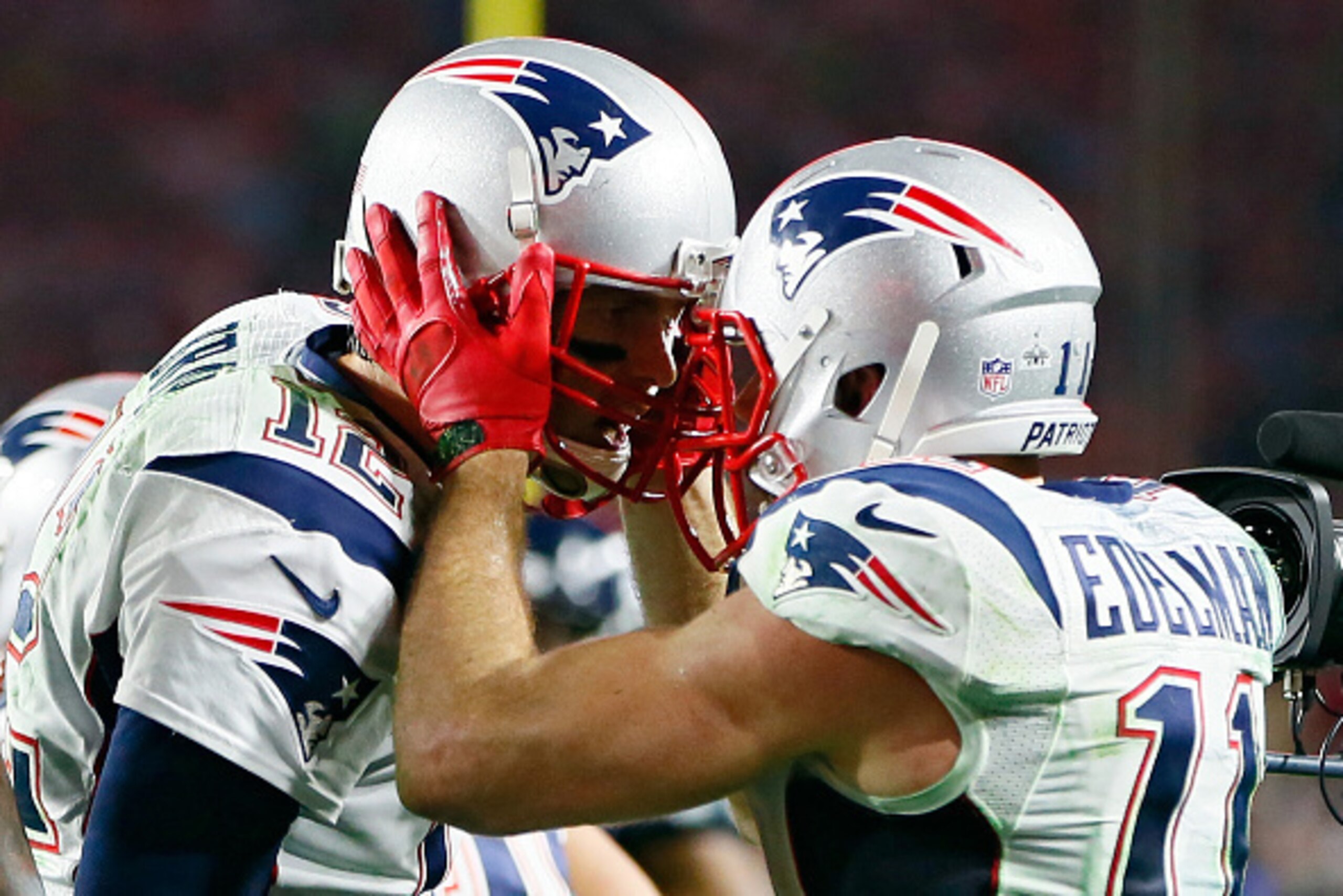GLENDALE, AZ - FEBRUARY 01:  Tom Brady #12 and  Julian Edelman #11 of the New England Patriots celebrate after a three yard touchdown pass in the fourth quarter against the Seattle Seahawks during Super Bowl XLIX at University of Phoenix Stadium on Februa