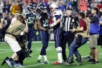 Feb 1, 2015; Glendale, AZ, USA; New England Patriots quarterback Tom Brady (12) and Seattle Seahawks cornerback Richard Sherman (25) shakes hands after in Super Bowl XLIX at University of Phoenix Stadium. Mandatory Credit: Matthew Emmons-USA TODAY Sports