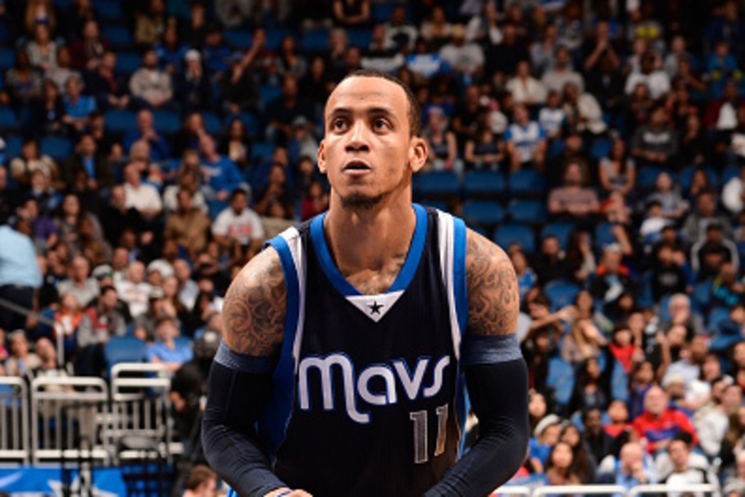 ORLANDO, FL - JANUARY 31: Monta Ellis #11 of the Dallas Mavericks attempts a free throw against the Orlando Magic on January 31, 2015 at Amway Center in Orlando, Florida. NOTE TO USER: User expressly acknowledges and agrees that, by downloading and or usi