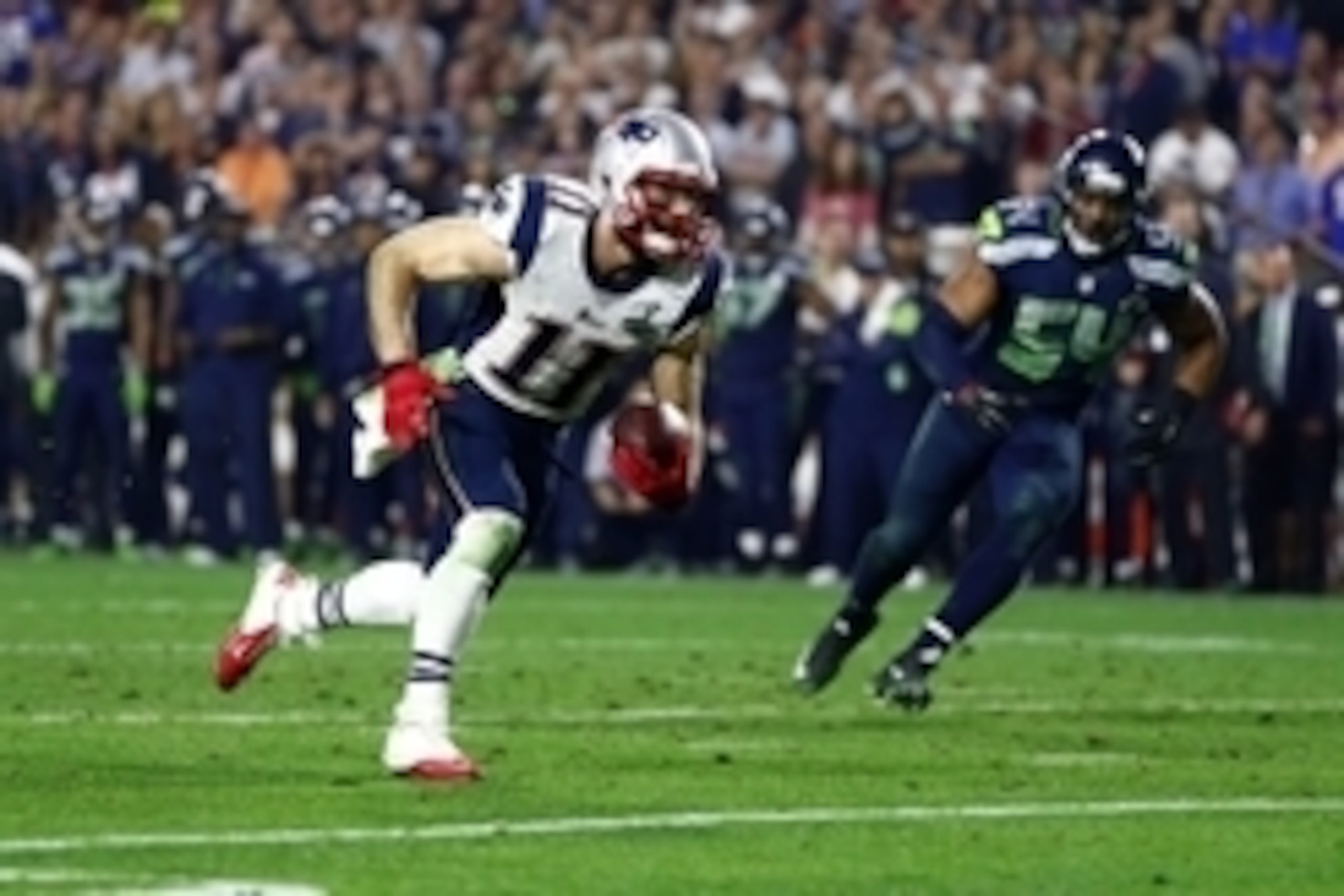 Feb 1, 2015; Glendale, AZ, USA; New England Patriots wide receiver Julian Edelman (11) runs against the Seattle Seahawks in the fourth quarter in Super Bowl XLIX at University of Phoenix Stadium. Mandatory Credit: Mark J. Rebilas-USA TODAY Sports