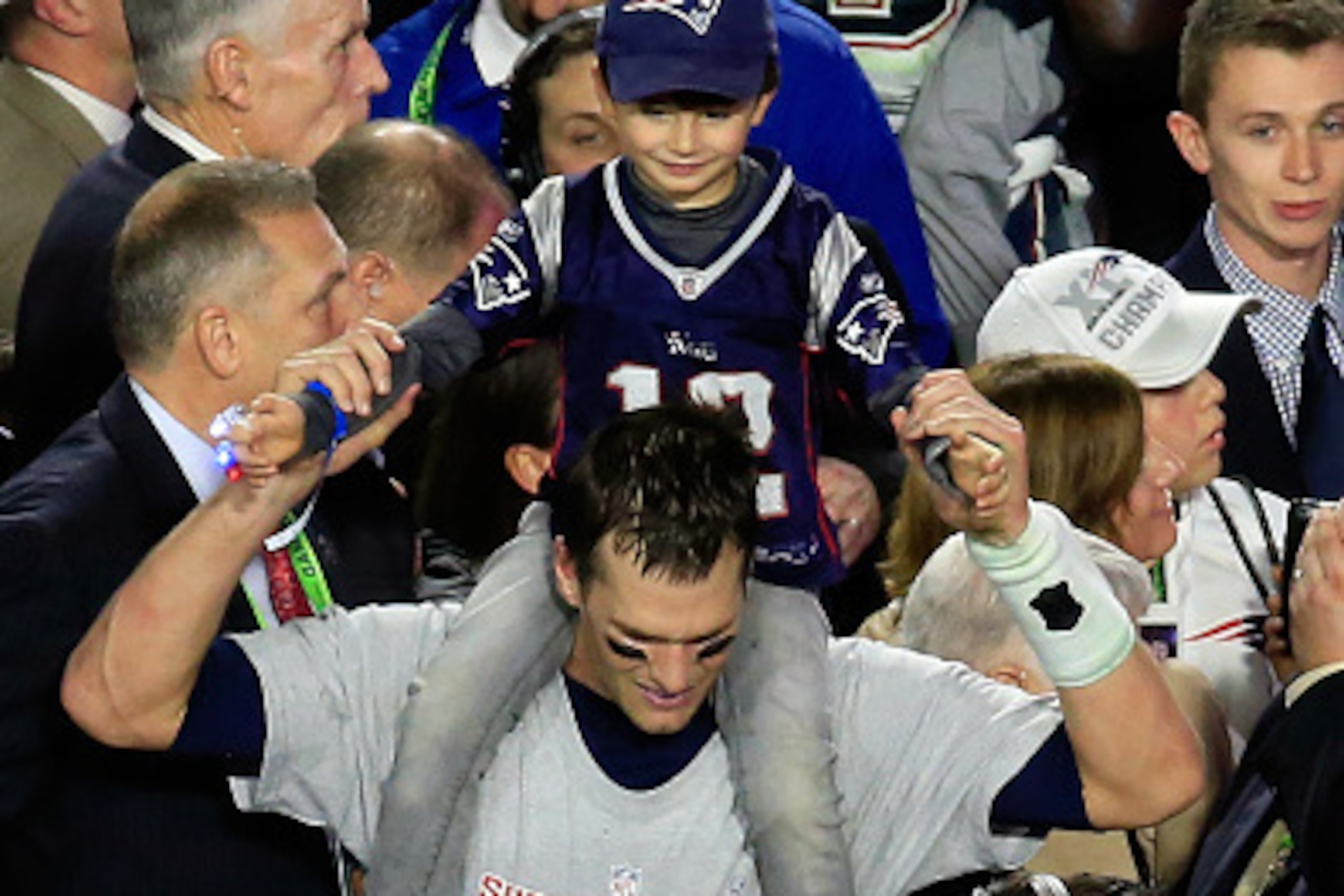 GLENDALE, AZ - FEBRUARY 01:  Tom Brady #12 of the New England Patriots celebrates with his son Benjamin after defeating the Seattle Seahawks during Super Bowl XLIX at University of Phoenix Stadium on February 1, 2015 in Glendale, Arizona. The Patriots def