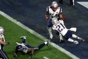 Feb 1, 2015; Glendale, AZ, USA; New England Patriots strong safety Malcolm Butler (21) makes an interception during the fourth quarter against the Seattle Seahawks in Super Bowl XLIX at University of Phoenix Stadium. Mandatory Credit: Richard Mackson-USA 