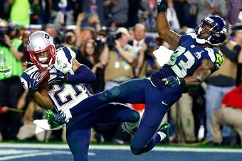 Feb 1, 2015; Glendale, AZ, USA; New England Patriots strong safety Malcolm Butler (21) intercepts a pass intended for Seattle Seahawks wide receiver Ricardo Lockette (83) in the fourth quarter in Super Bowl XLIX at University of Phoenix Stadium. Mandatory