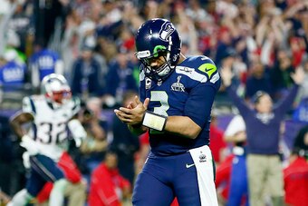 GLENDALE, AZ - FEBRUARY 01:  Russell Wilson #3 of the Seattle Seahawks looks on after his pass is intercepted by Malcolm Butler #21 of the New England Patriots late in the fourth quarter against the New England Patriots during Super Bowl XLIX at Universit