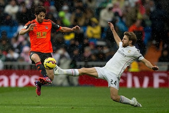 MADRID, SPAIN - JANUARY 31: Esteban Granero (L) Real Sociedad de Futbol competes for the ball with Asier Illarramendi (R) of Real Madrid CF during the La Liga match between Real Madrid CF and Real Sociedad de Futbol at Estadio Santiago Bernabeu on January