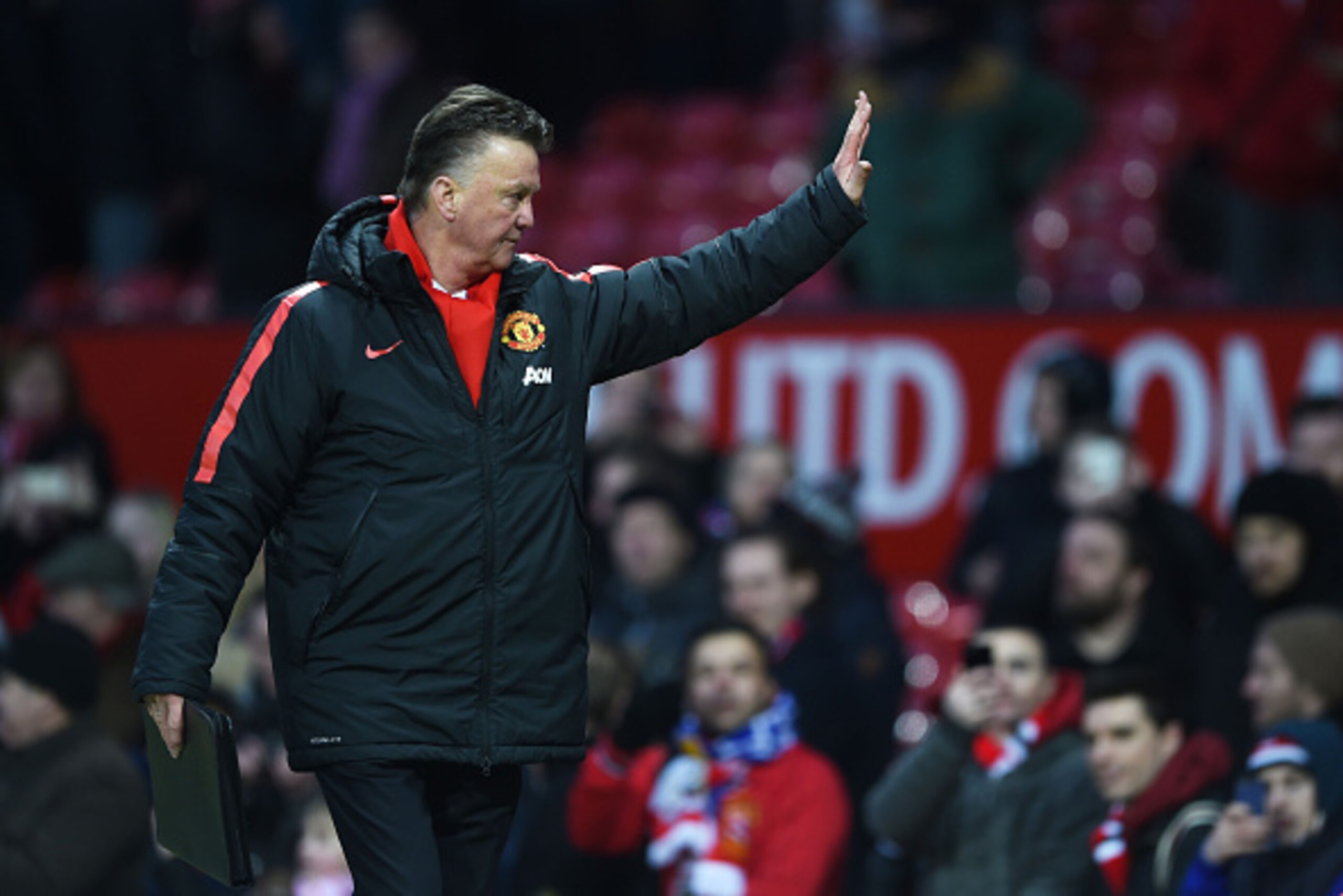 MANCHESTER, ENGLAND - JANUARY 31:  Manager Louis van Gaal of Manchester United waves to the fans following his team's 3-1 victory during the Barclays Premier League match between Manchester United and Leicester City at Old Trafford on January 31, 2015 in 