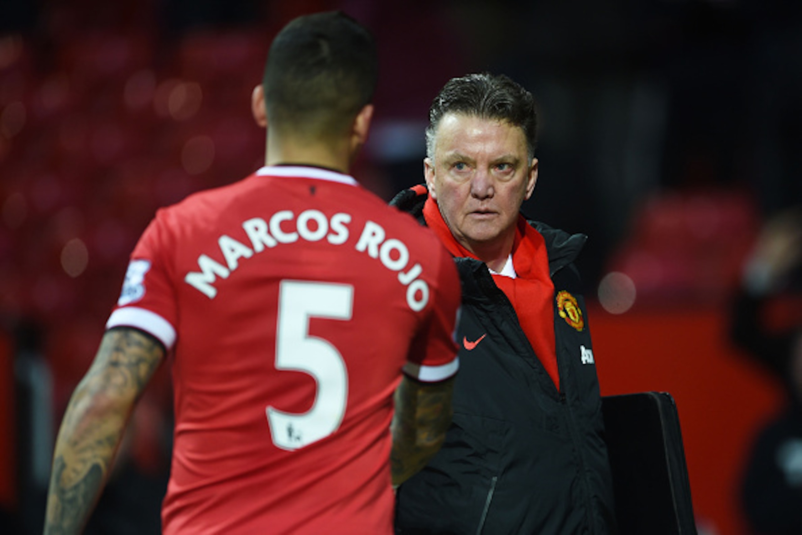 MANCHESTER, ENGLAND - JANUARY 31:  Manager Louis van Gaal of Manchester United shakes hands with Marcos Rojo of Manchester United following their team's 3-1 victory during the Barclays Premier League match between Manchester United and Leicester City at O