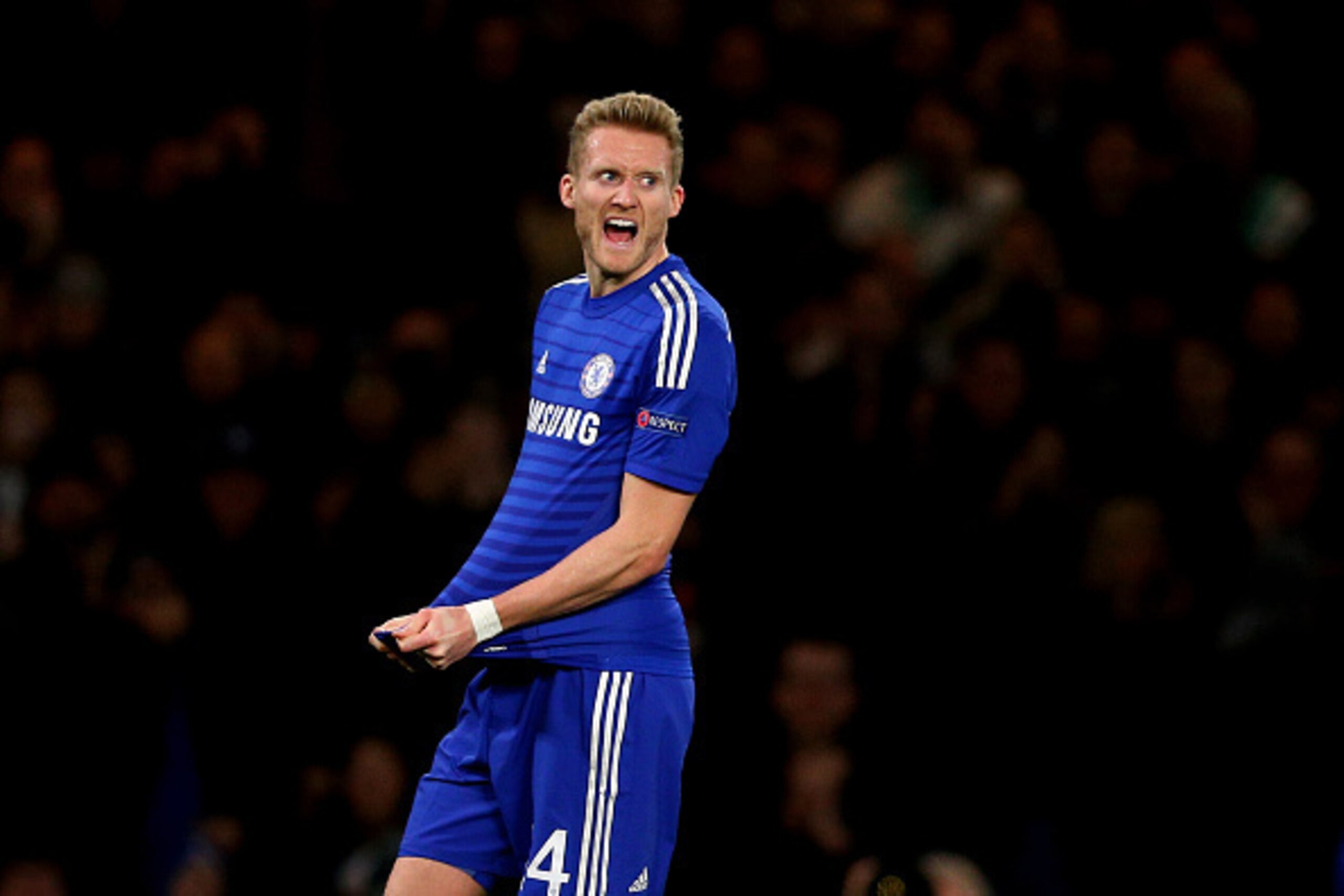 LONDON, ENGLAND - DECEMBER 10:  Andre Schuerrle of Chelsea celebrates after scoring his team's second goal during the UEFA Champions League group G match between Chelsea and Sporting Clube de Portugal at Stamford Bridge on December 10, 2014 in London, Uni