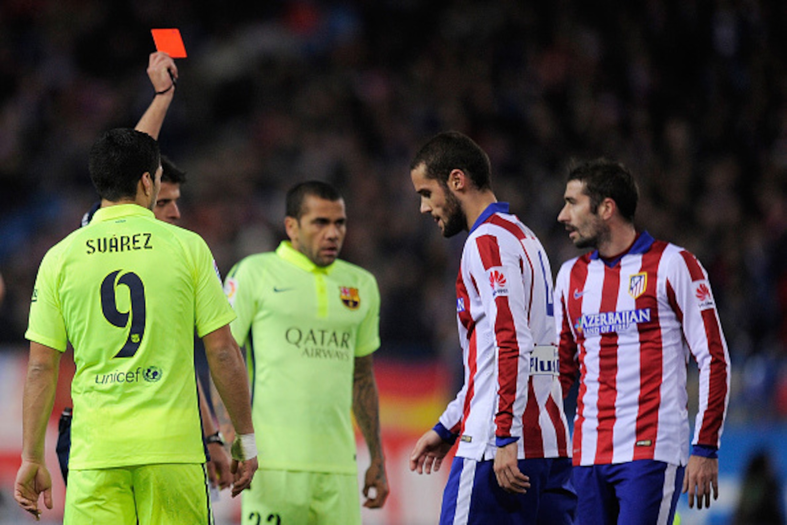 MADRID, SPAIN - JANUARY 28:  Mario Suarez (2.R) of Club Atletico de Madrid is sent off by referee Gil Manzano during the Copa del Rey Quarter Final Second Leg match between Club Atletico de Madrid and FC Barcelona at Vicente Calderon Stadium on January 28