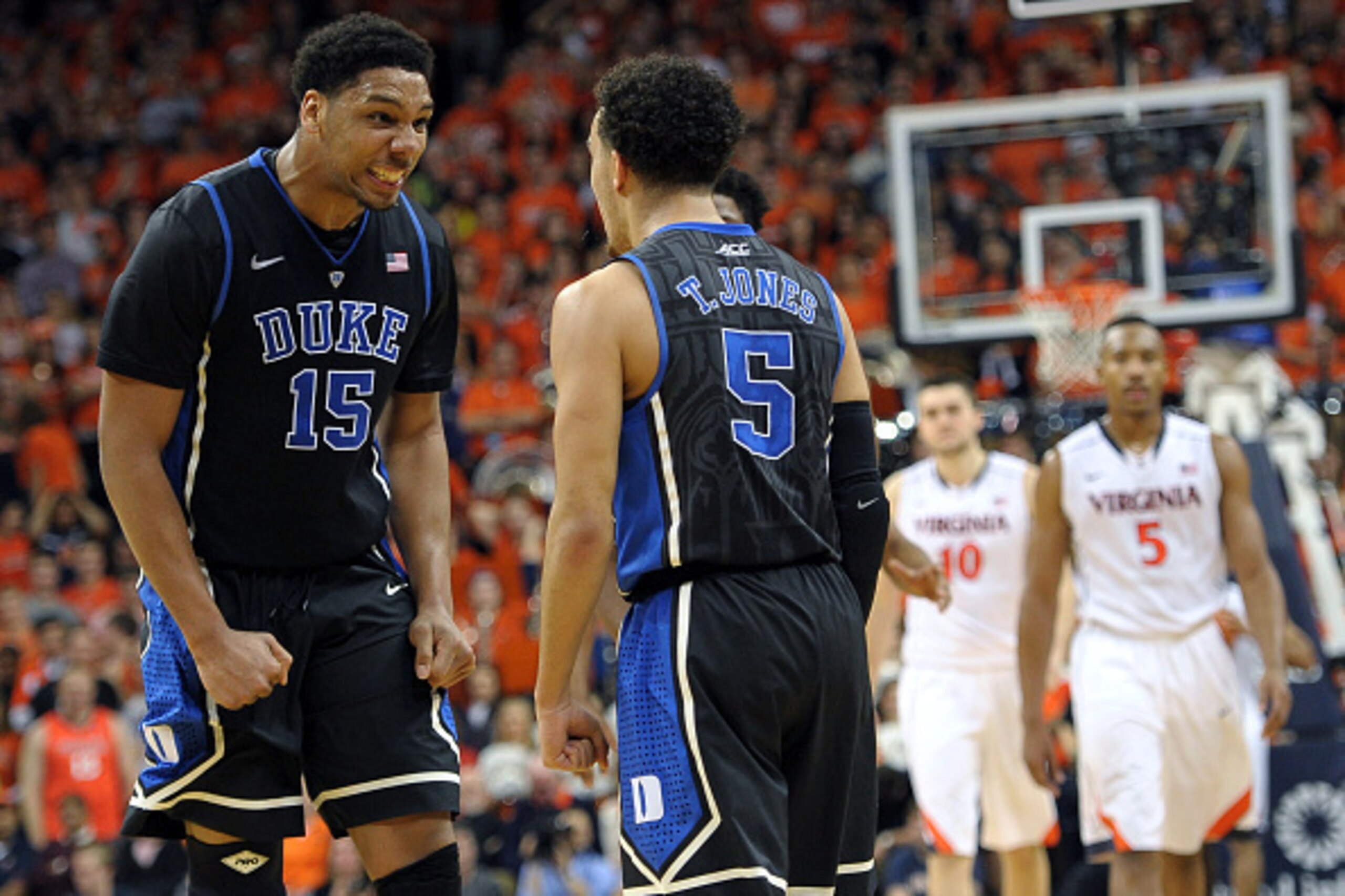 CHARLOTTESVILLE, VA - JANUARY 31: Jahlil Okafor #15 and Tyus Jones #5 of the Duke Blue Devils celebrate following a late-three pointer by Jones against the Virginia Cavaliers at John Paul Jones Arena on January 31, 2015 in Charlottesville, Virginia. (Phot