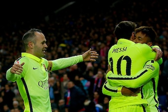 MADRID, SPAIN - JANUARY 28:  Neymar JR. of FC Barcelona embraces his teammate Lionel Messi (2ndL) celebrating scoring their third goal as Andres Iniesta (L) approaches them during the Copa del Rey Round of 8 second leg match between Club Atletico de Madri