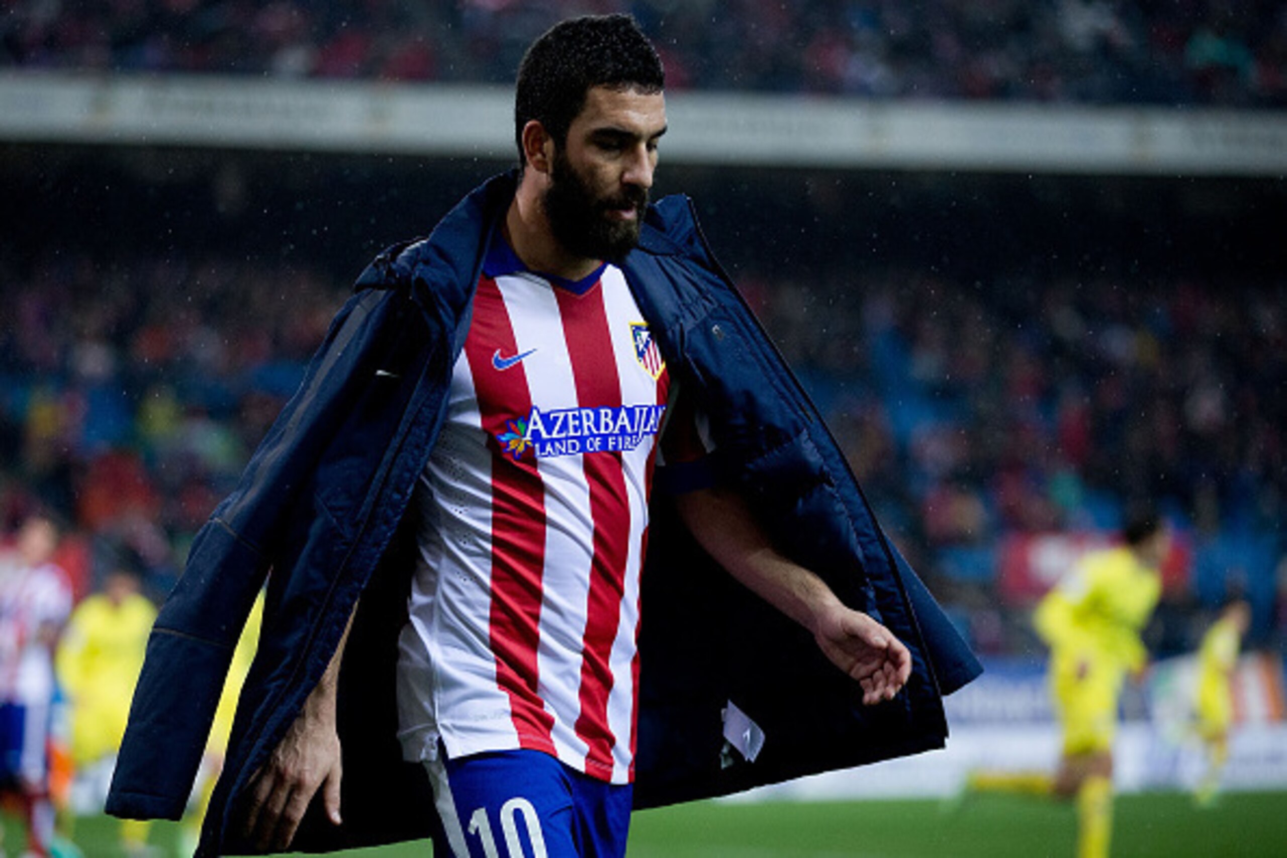 MADRID, SPAIN - DECEMBER 14: Arda Turan of Atletico de Madrid leaves the picth during the La Liga match between Club Atletico de Madrid and Villarreal CF at Vicente Calderon Stadium on December 14, 2014 in Madrid, Spain. (Photo by Gonzalo Arroyo Moreno/G MADRID, SPAIN - DECEMBER 14: Arda Turan of Atletico de Madrid leaves the picth during the La Liga match between Club Atletico de Madrid and Villarreal CF at Vicente Calderon Stadium on December 14, 2014 in Madrid, Spain. (Photo by Gonzalo Arroyo Moreno/G