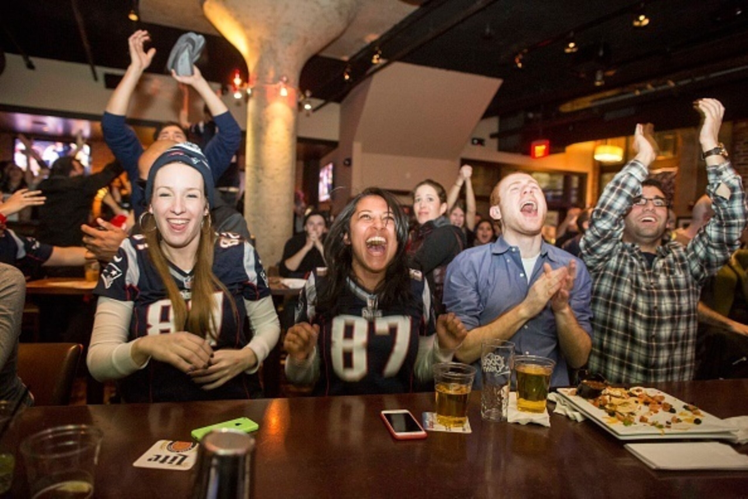 OSTON, MA - FEBRUARY 1:  New England Patriots fans cheer after the  Patriots defeated the Seattle Seahawks in Super Bowl XLIX at Jerry Remy's Sports Bar February 1, 2015 in Boston, Massachusetts. (Photo by Scott Eisen/Getty Images)