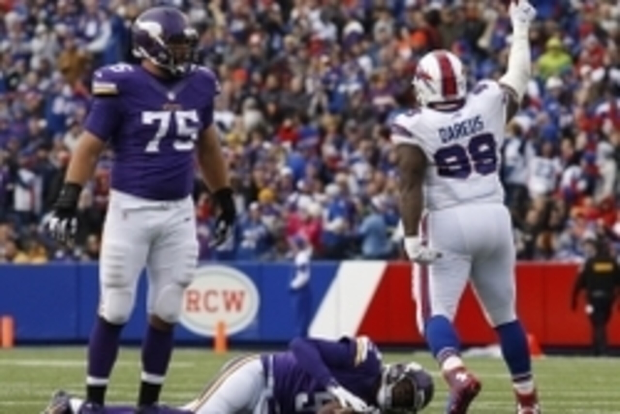 Oct 19, 2014; Orchard Park, NY, USA; Minnesota Vikings tackle Matt Kalil (75) watches as Buffalo Bills defensive tackle Marcell Dareus (99) celebrates a sack on Minnesota Vikings quarterback Teddy Bridgewater (5) during the second half at Ralph Wilson Sta Oct 19, 2014; Orchard Park, NY, USA; Minnesota Vikings tackle Matt Kalil (75) watches as Buffalo Bills defensive tackle Marcell Dareus (99) celebrates a sack on Minnesota Vikings quarterback Teddy Bridgewater (5) during the second half at Ralph Wilson Sta