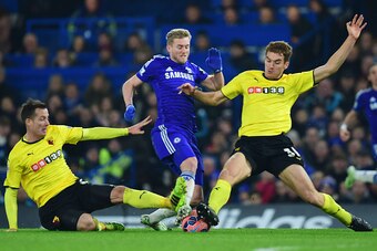 LONDON, ENGLAND - JANUARY 04:  Andre Schuerrle of Chelsea (C) is challenged by Daniel Tozser (L) and Tommie Hoban of Watford during the FA Cup Third Round match between Chelsea and Watford at Stamford Bridge on January 4, 2015 in London, England.  (Photo 