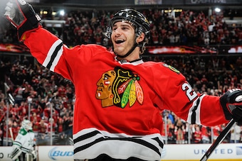 CHICAGO, IL - JANUARY 04:  Brandon Saad #20 of the Chicago Blackhawks reacts after Patrick Sharp #10 (not pictured) scored the game winning goal against the Dallas Stars in overtime of the NHL game at the United Center on January 4, 2015 in Chicago, Illin
