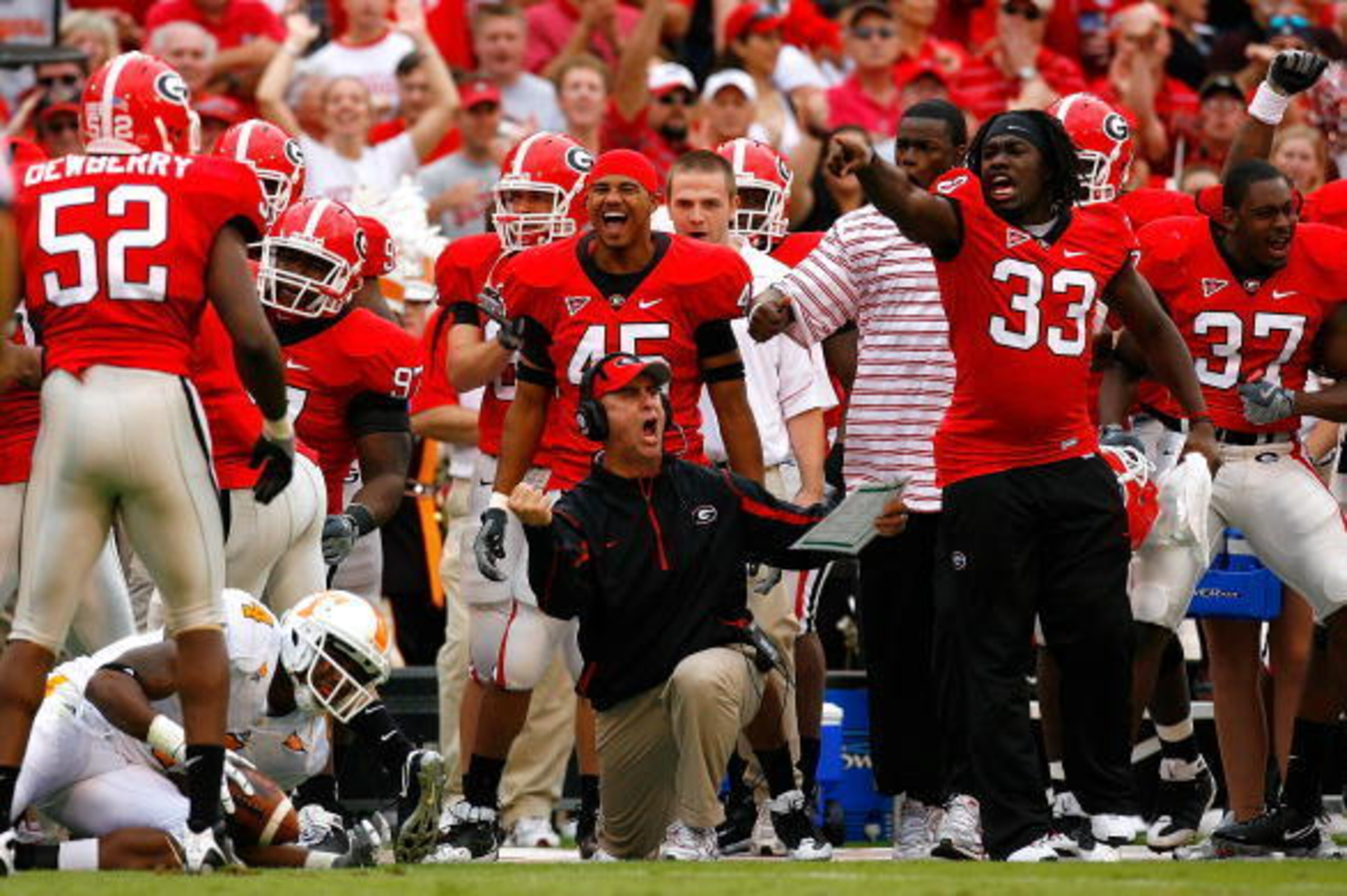 ATHENS, GA - OCTOBER 11:  Defensive coordinator Willie Martinez (C) of the Georgia Bulldogs and the bench errupt in celebration after a defensive stop against the Tennessee Volunteers during the game at Sanford Stadium on October 11, 2008 in Athens, Georg