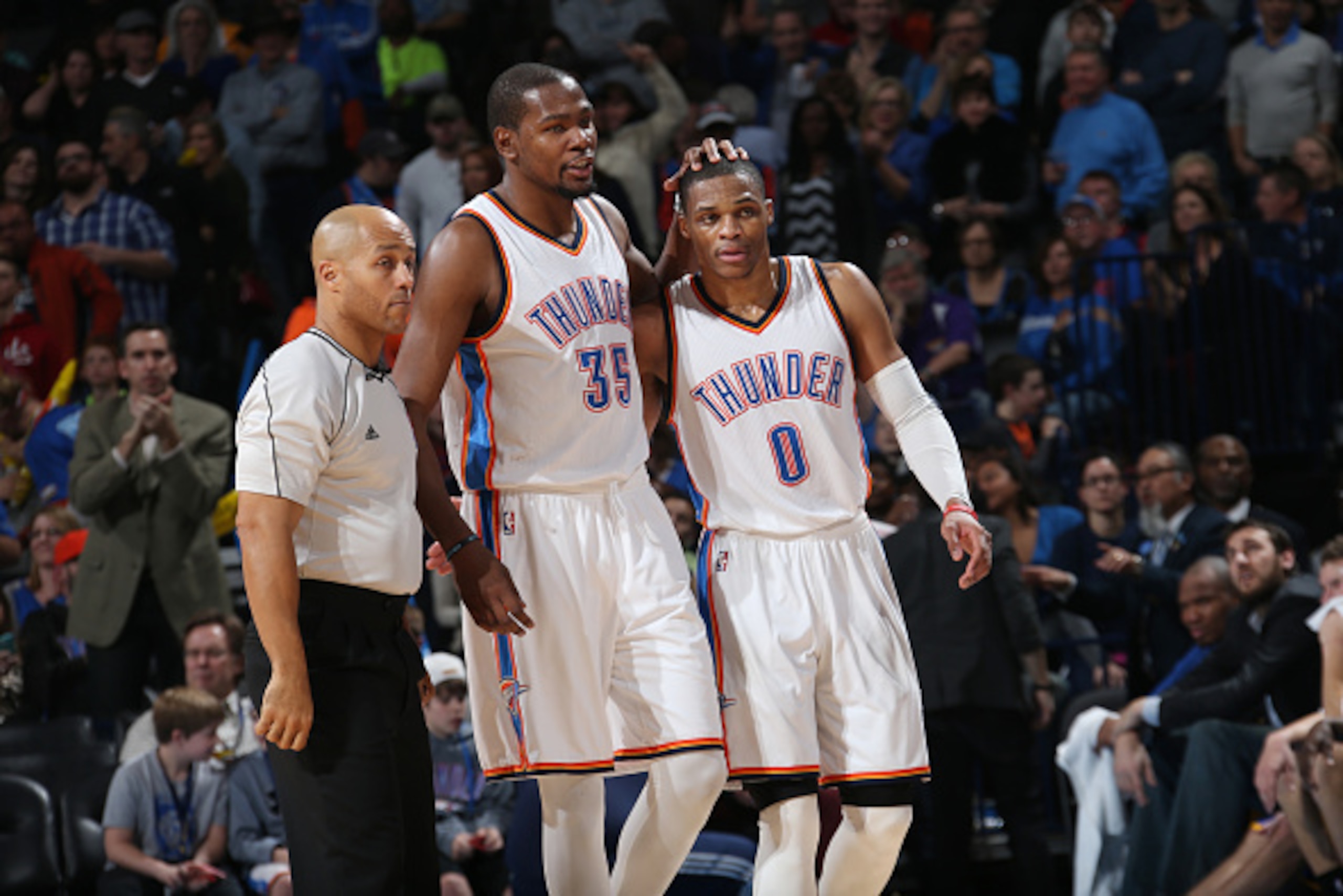 OKLAHOMA CITY, OK- JANUARY 16: Kevin Durant #35 and Russell Westbrook #0 of the Oklahoma City Thunder celebrate during a game against the Golden State Warriors on January 16, 2015 at Chesapeake Energy Arena in Oklahoma City, OK. NOTE TO USER: User express