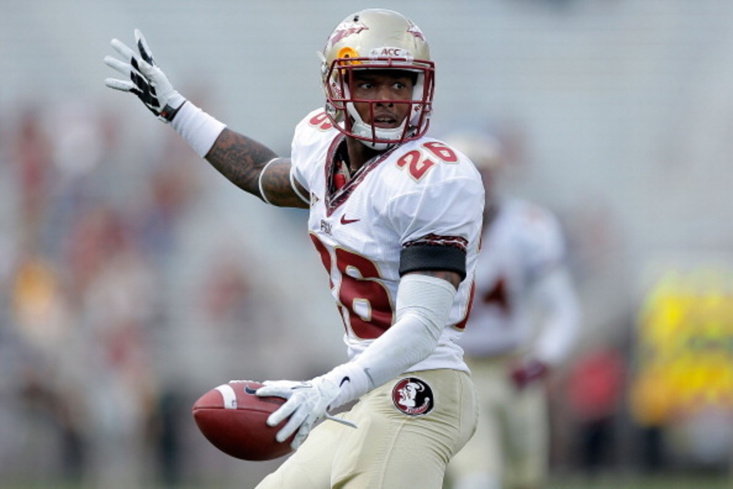TALLAHASSEE, FL - APRIL 12:  P.J. Williams #26 of the Gold team reacts to a recovered fumble against the Garnet team during Florida State's Garnet and Gold spring game at Doak Campbell Stadium on April 12, 2014 in Tallahassee, Florida.  (Photo by Stacy Re