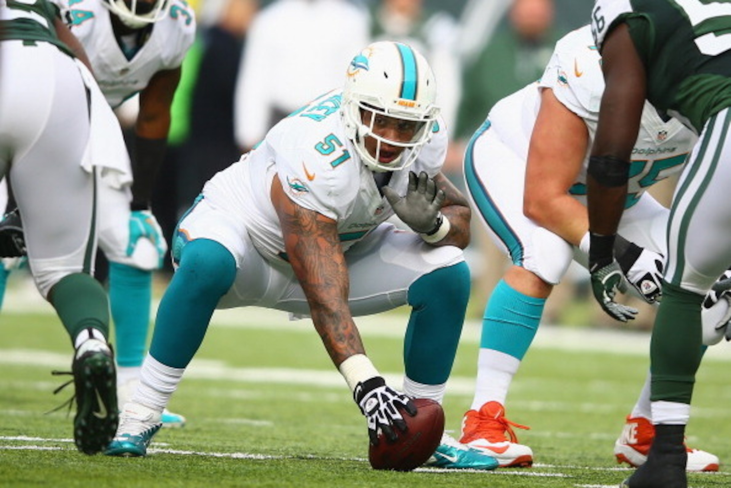 EAST RUTHERFORD, NJ - DECEMBER 01:  Mike Pouncey #51 of the Miami Dolphins in action against the New York Jets  during their game at MetLife Stadium on December 1, 2013 in East Rutherford, New Jersey.  (Photo by Al Bello/Getty Images)