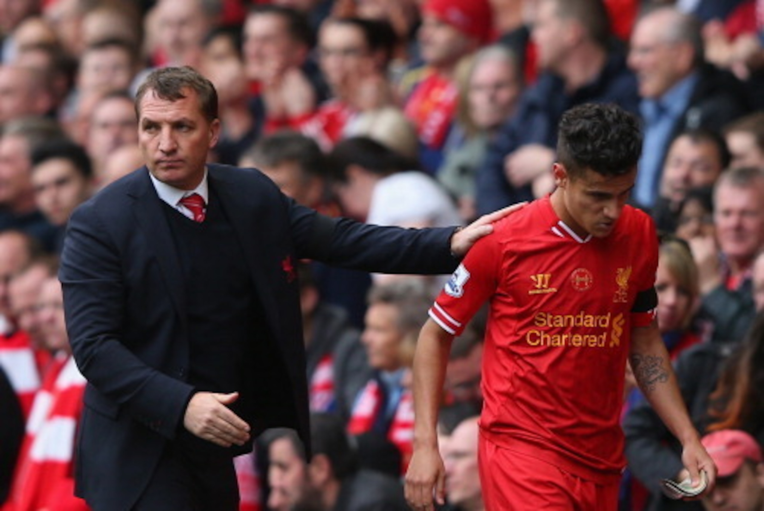 LIVERPOOL, ENGLAND - APRIL 13:  Liverpool Manager Brendan Rodgers congratulates Philippe Coutinho as he is substituted during the Barclays Premier League match between Liverpool and Manchester City at Anfield on April 13, 2014 in Liverpool, England.  (Pho