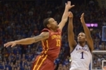 Feb 2, 2015; Lawrence, KS, USA; Kansas Jayhawks guard Wayne Selden Jr. (1) shoots the ball as Iowa State Cyclones guard Bryce Dejean-Jones (13) defends during the second half at Allen Fieldhouse. The Jayhawks won 89-76. Mandatory Credit: Denny Medley-USA 