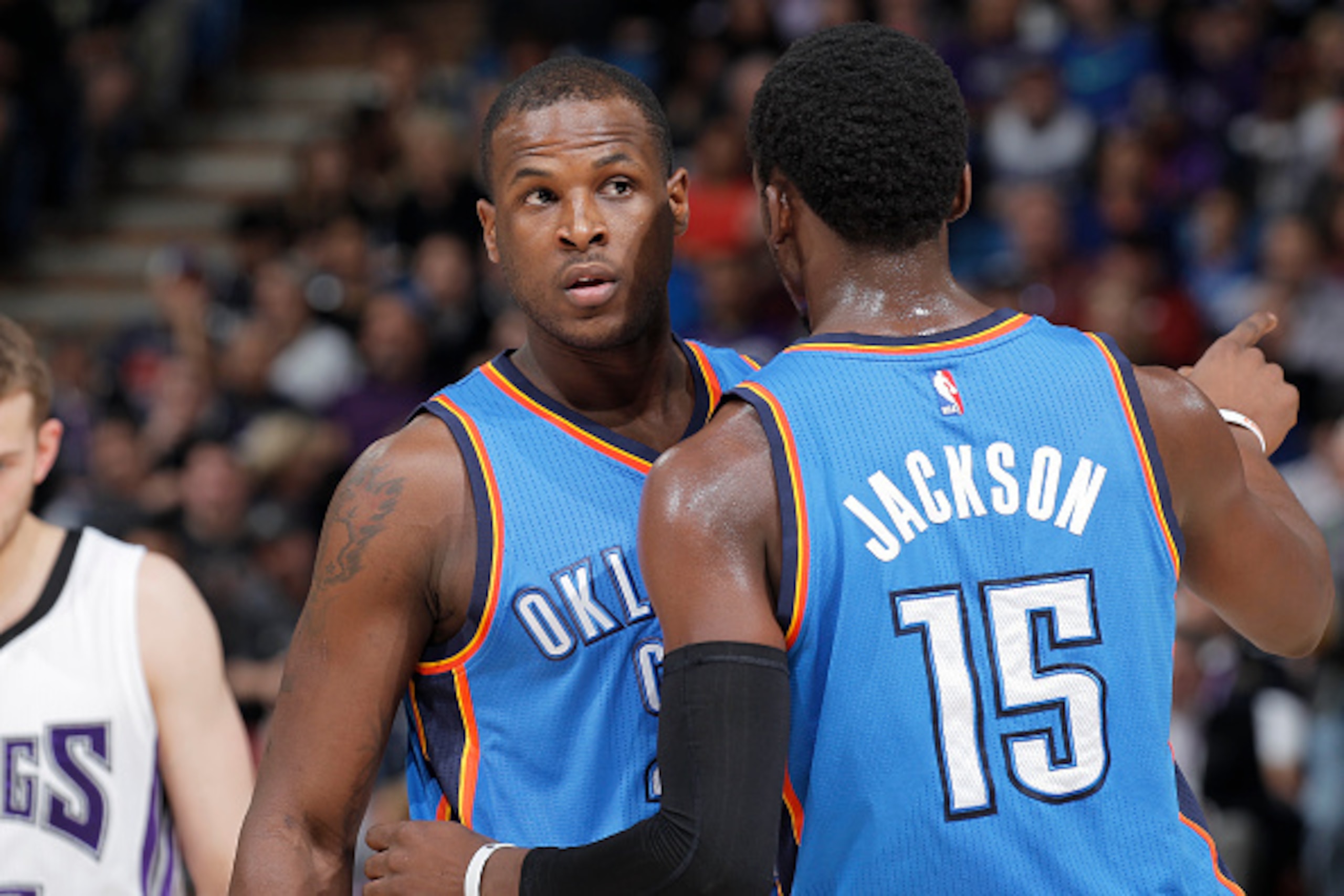 SACRAMENTO, CA - JANUARY 7: Dion Waiters #23 and Reggie Jackson #15 of the Oklahoma City Thunder talk during the game against the Sacramento Kings on January 7, 2015 at Sleep Train Arena in Sacramento, California. NOTE TO USER: User expressly acknowledges