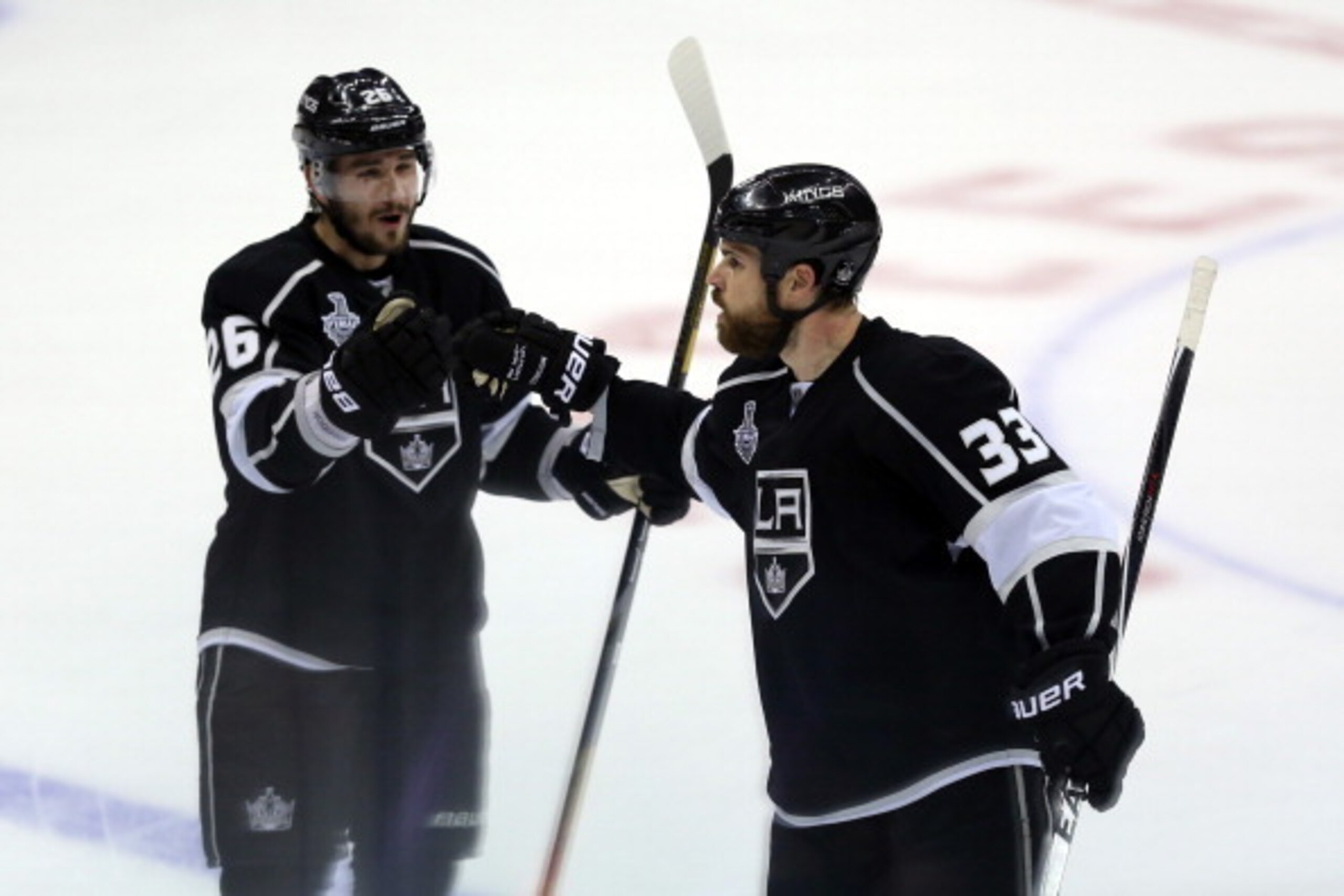 LOS ANGELES, CA - JUNE 07:  Willie Mitchell #33 celebrates with Slava Voynov #26 after Mitchell scores in the second period against the New York Rangers during Game Two of the 2014 NHL Stanley Cup Final at the Staples Center on June 7, 2014 in Los Angeles
