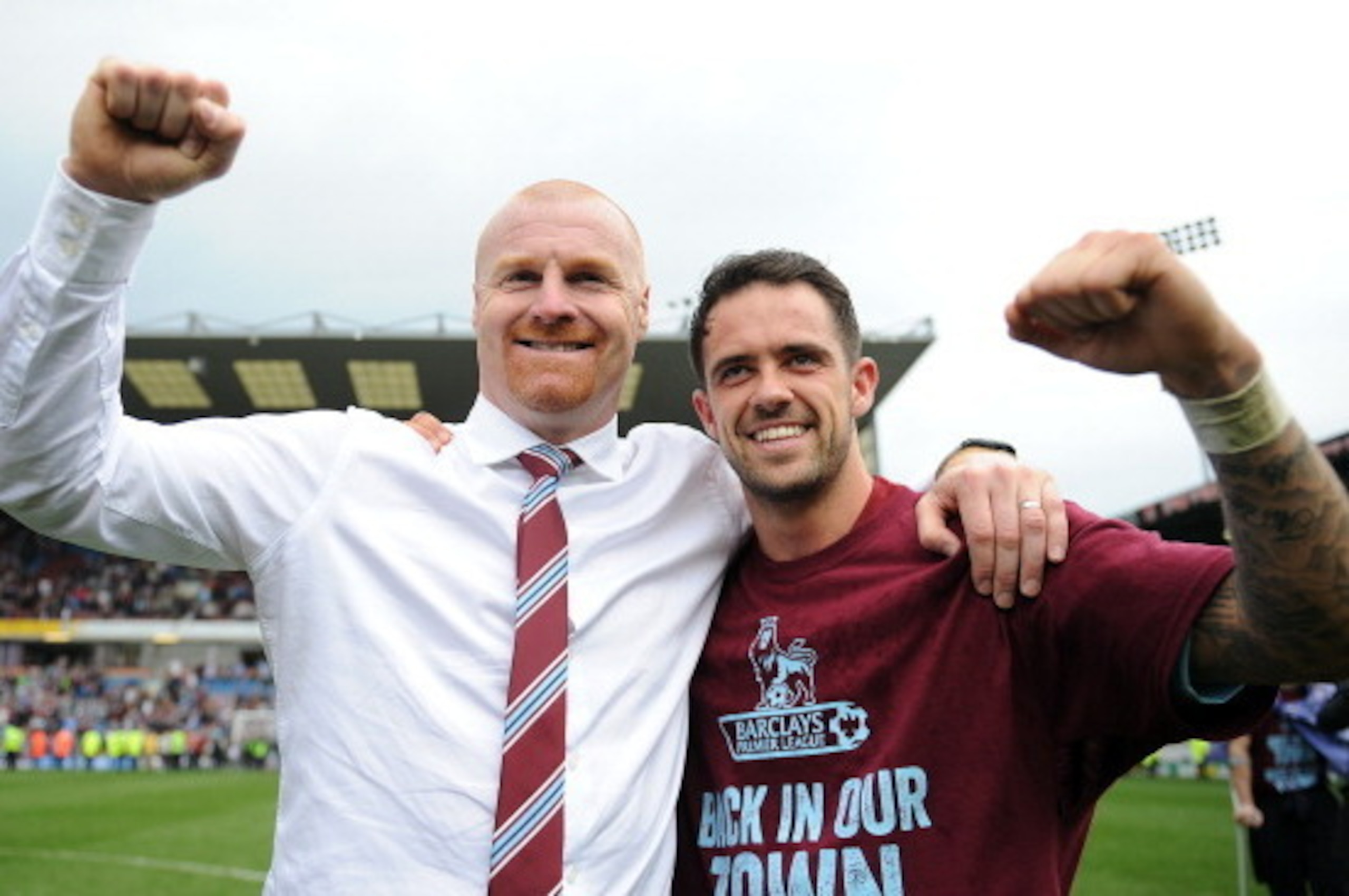 BURNLEY, ENGLAND - APRIL 21: Burnley manager Sean Dyche celebrates with Danny Ings following the Sky Bet Championship match between Burnley and Wigan Athletic at Turf Moor on April 21, 2014 in Burnley, England. (Photo by Chris Brunskill/Getty Images)