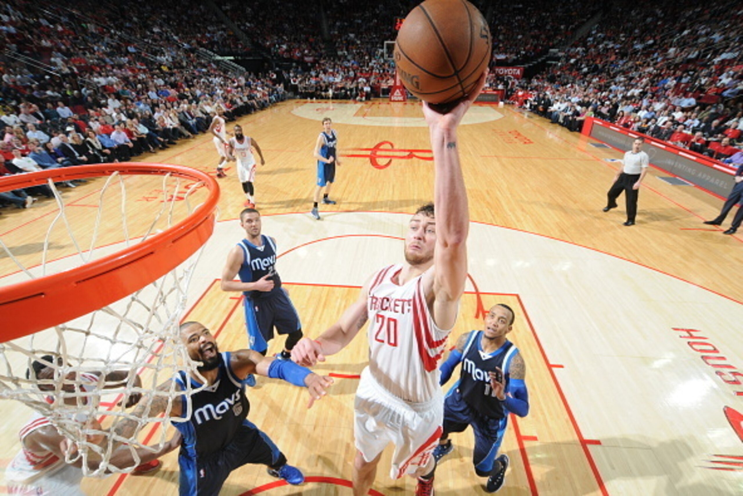 HOUSTON, TX - JANUARY 28:  Donatas Motiejunas #20 of the Houston Rockets goes to the basket against the Dallas Mavericks on January 28, 2015 at the Toyota Center in Houston, Texas. NOTE TO USER: User expressly acknowledges and agrees that, by downloading 