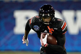 CHARLOTTE, NC - DECEMBER 30:  DeVante Parker #9 of the Louisville Cardinals warms up before the Belk Bowl against the Georgia Bulldogs at Bank of America Stadium on December 30, 2014 in Charlotte, North Carolina.  (Photo by Grant Halverson/Getty Images)