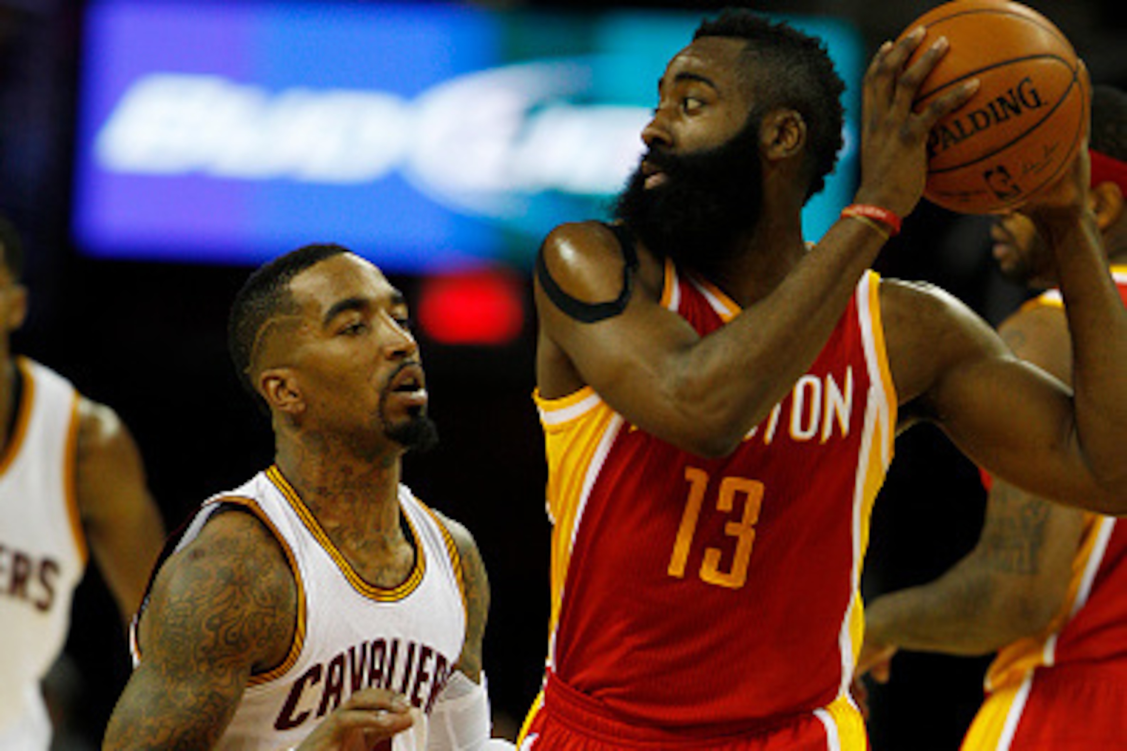 CLEVELAND, OH - JANUARY 7: J.R. Smith #5 of the Cleveland Cavaliers defends against James Harden #13 of the Houston Rockets during the second half of their game on January 7, 2015 at Quicken Loans Arena in Cleveland, Ohio. The Rockets defeated the Cavalie CLEVELAND, OH - JANUARY 7: J.R. Smith #5 of the Cleveland Cavaliers defends against James Harden #13 of the Houston Rockets during the second half of their game on January 7, 2015 at Quicken Loans Arena in Cleveland, Ohio. The Rockets defeated the Cavalie
