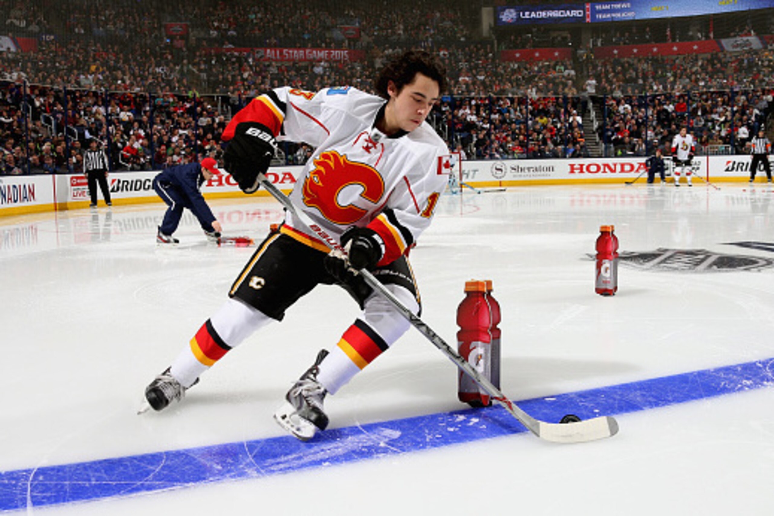 COLUMBUS, OH - JANUARY 24: Johnny Gaudreau #13 of the Calgary Flames and Team Toews competes in the Gatorade NHL Skills Challenge Relay event of the 2015 Honda NHL All-Star Skills Competition at Nationwide Arena on January 24, 2015 in Columbus, Ohio. (P COLUMBUS, OH - JANUARY 24: Johnny Gaudreau #13 of the Calgary Flames and Team Toews competes in the Gatorade NHL Skills Challenge Relay event of the 2015 Honda NHL All-Star Skills Competition at Nationwide Arena on January 24, 2015 in Columbus, Ohio. (P