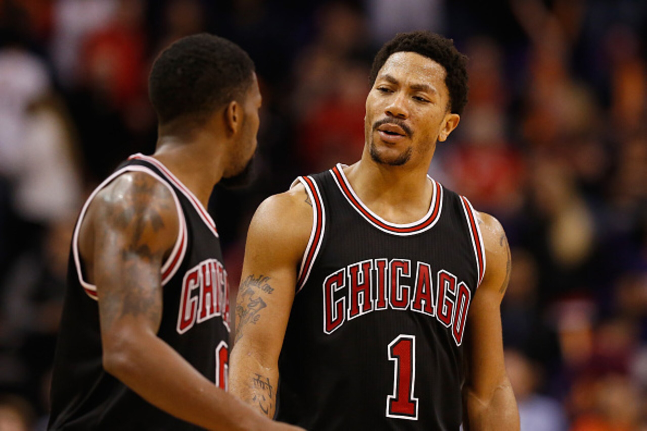 PHOENIX, AZ - JANUARY 30: Derrick Rose #1 and Aaron Brooks #0 of the Chicago Bulls during the second half of the NBA game against the Phoenix Suns at US Airways Center on January 30, 2015 in Phoenix, Arizona. The Suns defeated the Bulls 99-93. NOTE TO US PHOENIX, AZ - JANUARY 30: Derrick Rose #1 and Aaron Brooks #0 of the Chicago Bulls during the second half of the NBA game against the Phoenix Suns at US Airways Center on January 30, 2015 in Phoenix, Arizona. The Suns defeated the Bulls 99-93. NOTE TO US
