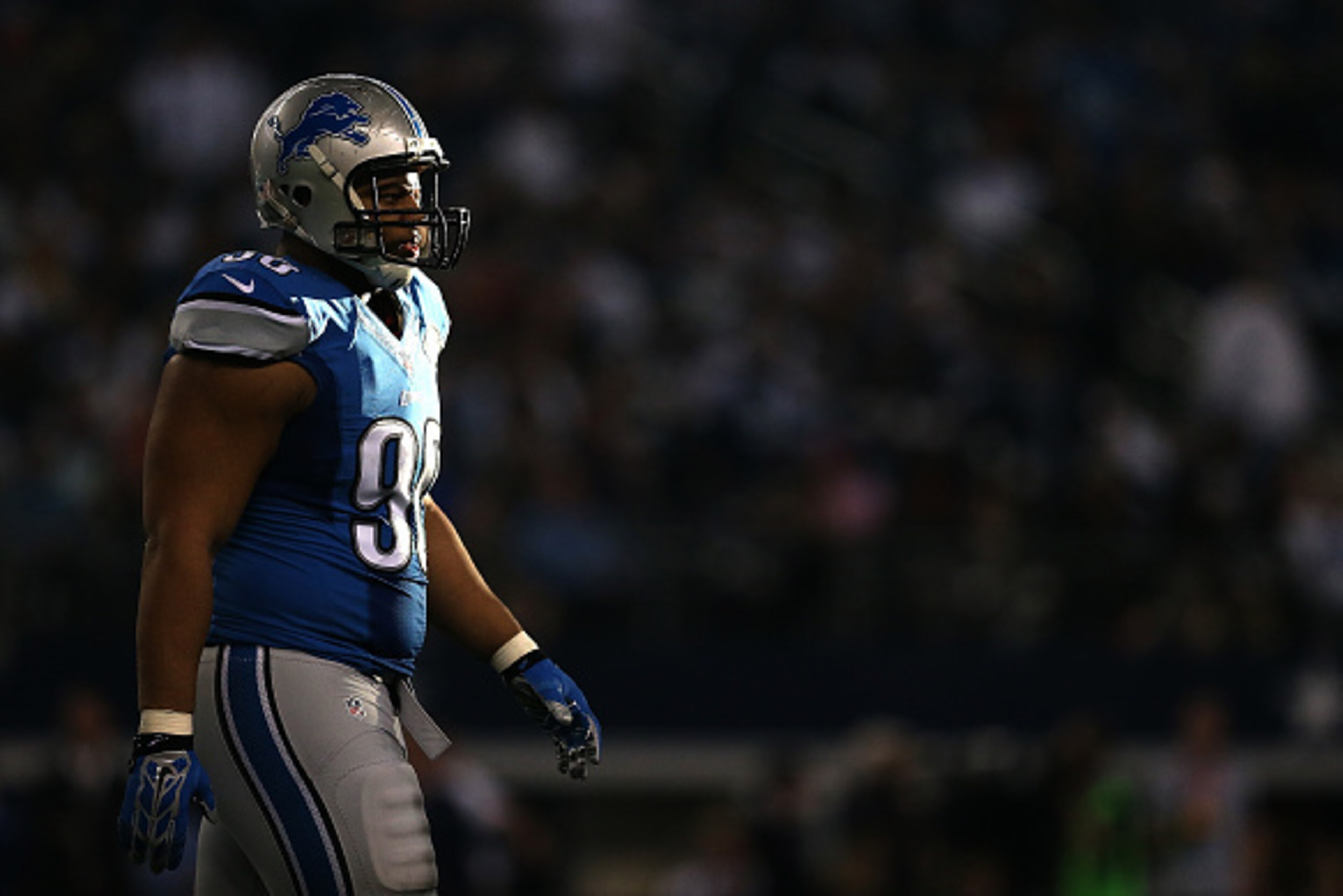 ARLINGTON, TX - JANUARY 04:  Ndamukong Suh #90 of the Detroit Lions looks on during a NFC Wild Card Playoff game against the Dallas Cowboys at AT&T Stadium on January 4, 2015 in Arlington, Texas.  (Photo by Sarah Glenn/Getty Images)