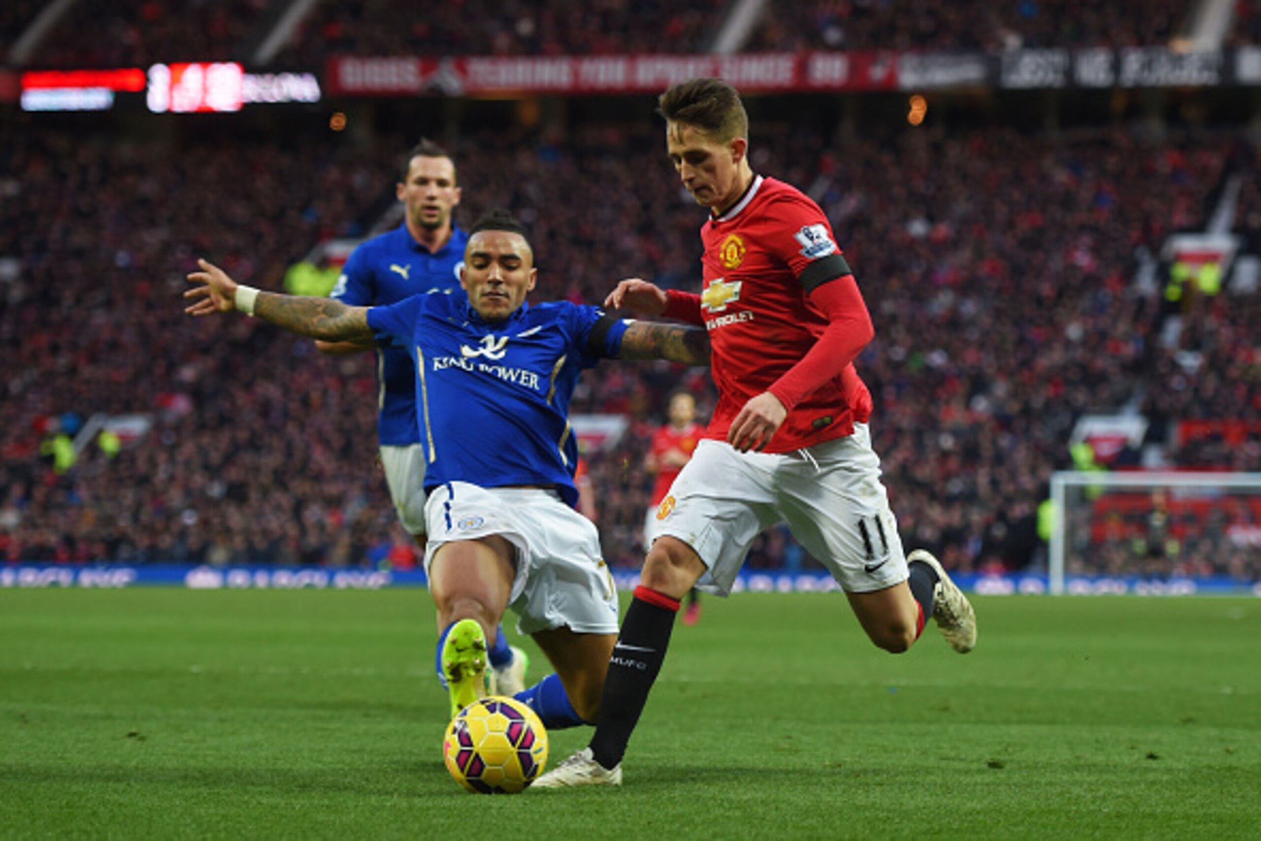 MANCHESTER, ENGLAND - JANUARY 31:  Adnan Januzaj of Manchester United is tackled by Danny Simpson of Leicester City during the Barclays Premier League match between Manchester United and Leicester City at Old Trafford on January 31, 2015 in Manchester, En