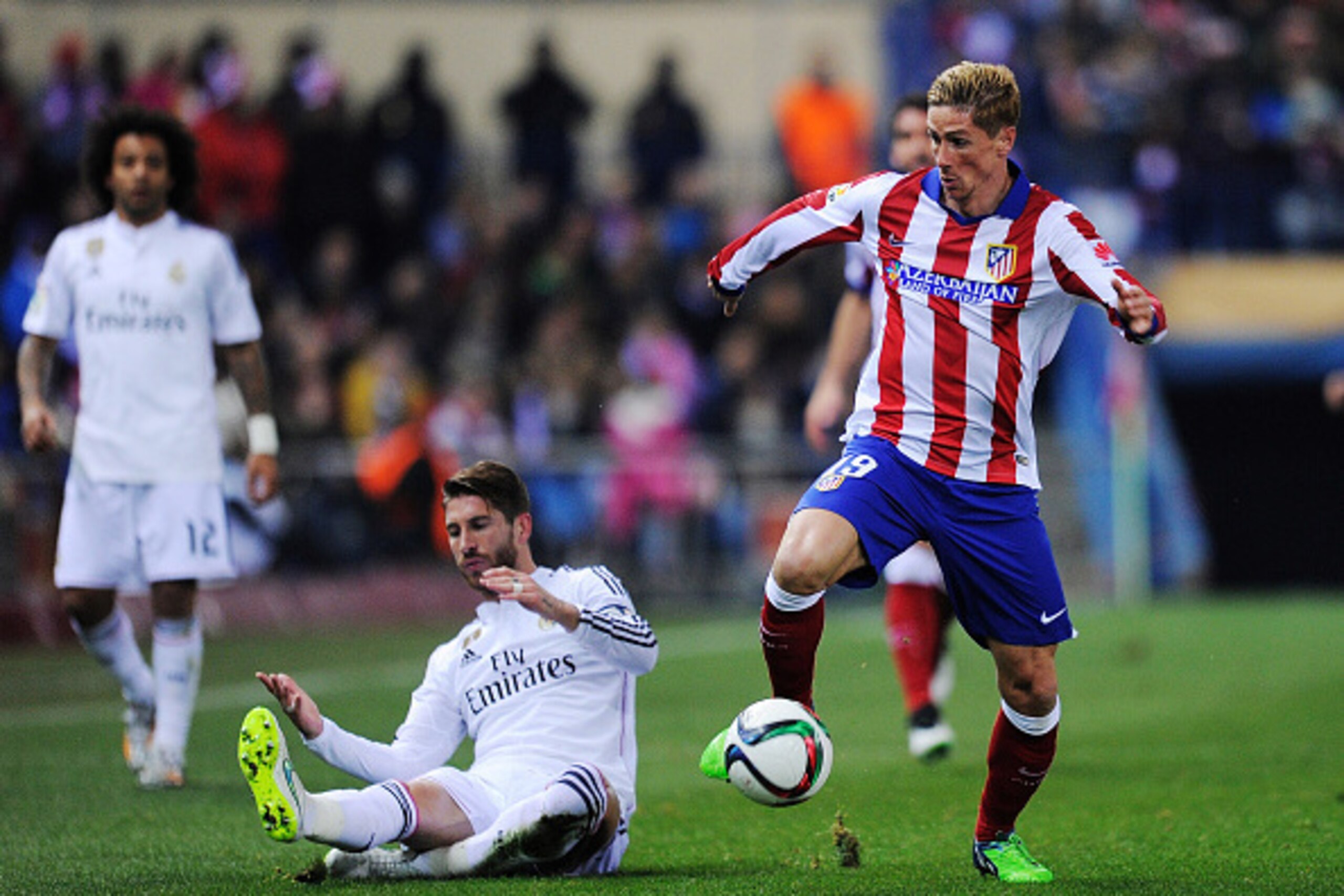 MADRID, SPAIN - JANUARY 07: Fernando Torres of Club Atletico de Madrid gets past Sergio Ramos of Real Madrid
during the Copa del Rey Round of 16, First Leg match between Club Atletico de Madrid and Real Madrid at Vicente Calderon Stadium on January 7, 20 MADRID, SPAIN - JANUARY 07: Fernando Torres of Club Atletico de Madrid gets past Sergio Ramos of Real Madrid
during the Copa del Rey Round of 16, First Leg match between Club Atletico de Madrid and Real Madrid at Vicente Calderon Stadium on January 7, 20