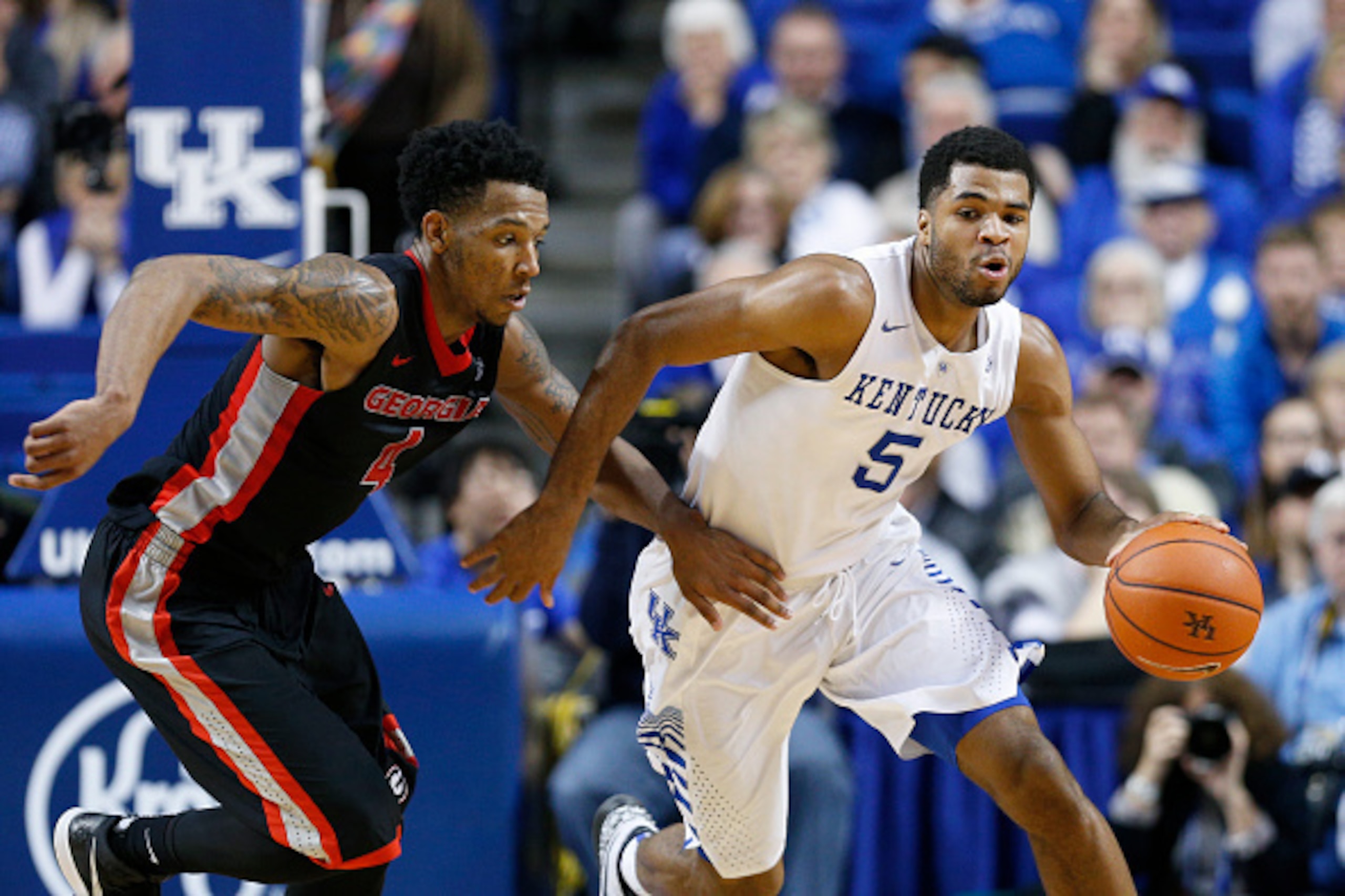 LEXINGTON, KY - FEBRUARY 3: Andrew Harrison #5 of the Kentucky Wildcats brings the ball up the floor against pressure from Charles Mann #4 of the Georgia Bulldogs during the game at Rupp Arena on February 3, 2015 in Lexington, Kentucky. Kentucky defeated 