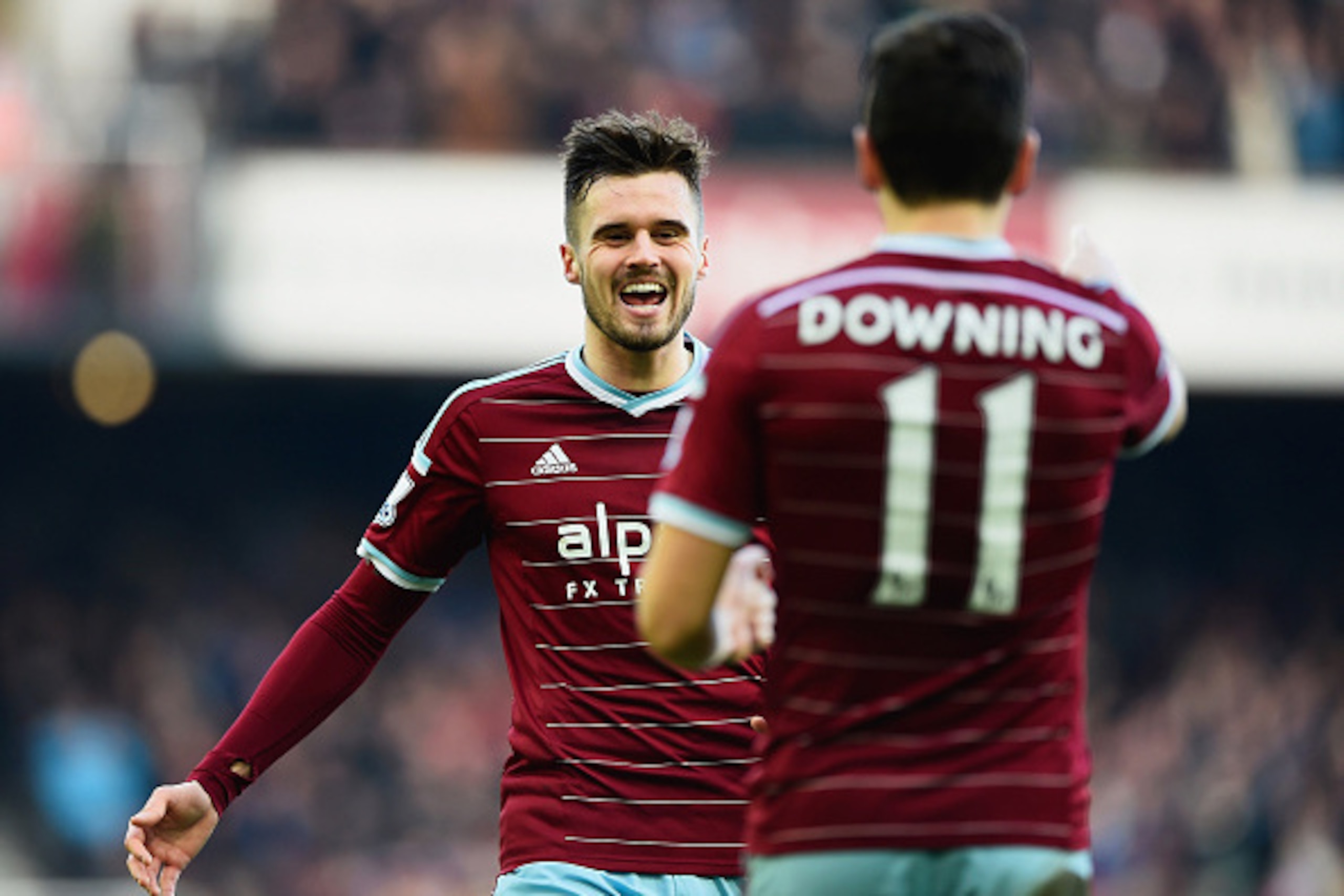 LONDON, ENGLAND - JANUARY 18:  Stewart Downing of West Ham United (11) celebrates with team mate Carl Jenkinson as he scores their third goal during the Barclays Premier League match between West Ham United and Hull City at Boleyn Ground on January 18, 20