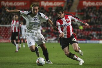 SOUTHAMPTON, UNITED KINGDOM - MARCH 16:  Gareth Bale of Southampton battles with Kevin Watson of Colchester during the Coca-Cola Championship match between Southampton and Colchester United at St Mary's Stadium on March 16, 2007 in Southampton, England.  