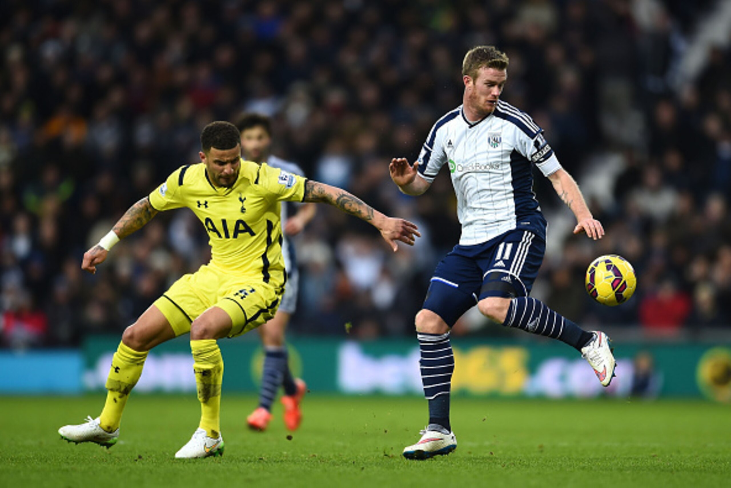 WEST BROMWICH, ENGLAND - JANUARY 31:  Chris Brunt of West Brom controls the ball under presure from Kyle Walker of Spurs during the Barclays Premier League match between West Bromwich Albion and Tottenham Hotspur at The Hawthorns on January 31, 2015 in We