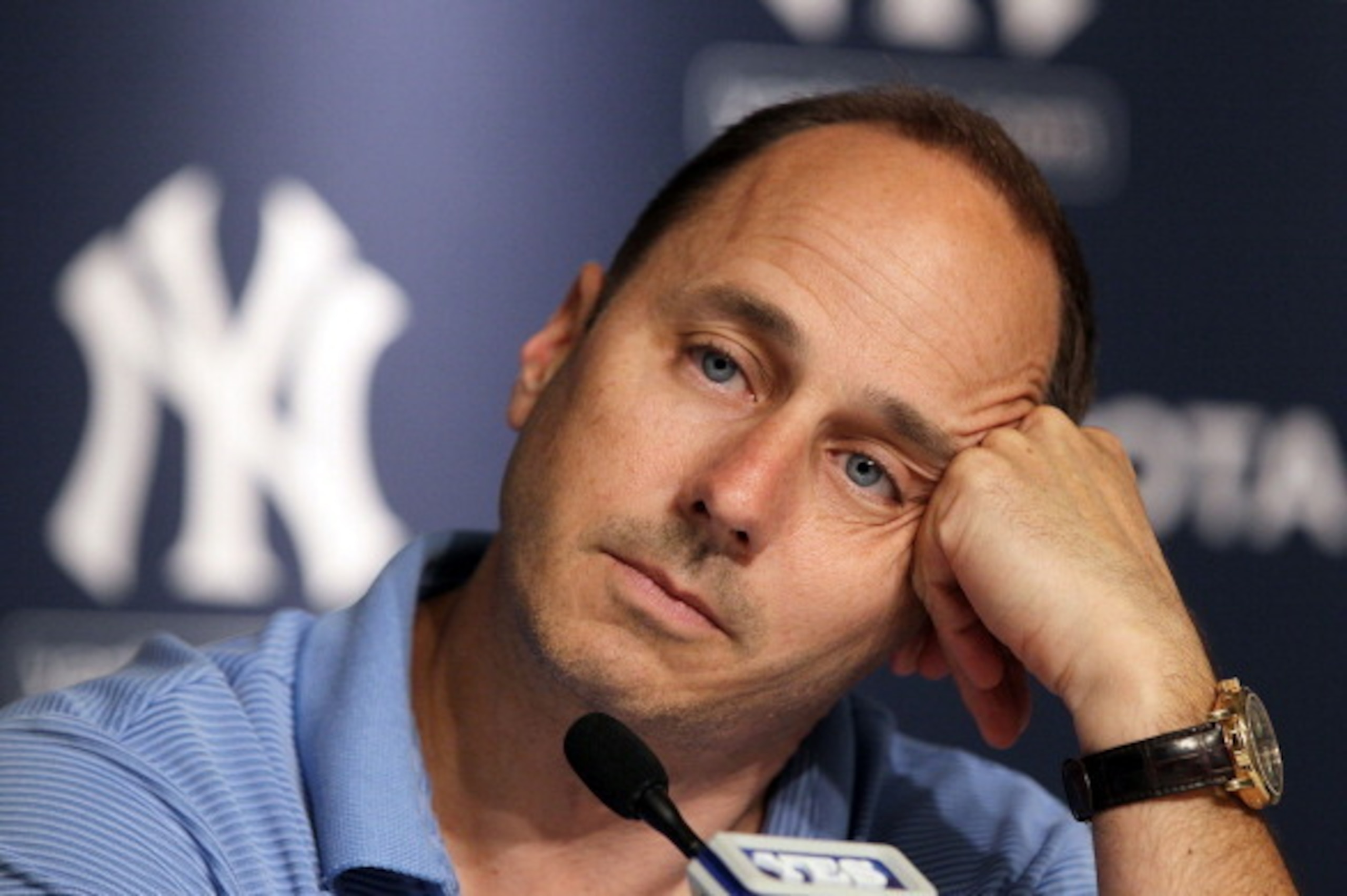 NEW YORK, NY - JULY 08:  General manager Brian Cashman of the New York Yankees speaks to the media after the game against the Tampa Bay Rays was postponed due to rain on July 8, 2011 at Yankee Stadium in the Bronx borough of New York City.  (Photo by Jim 