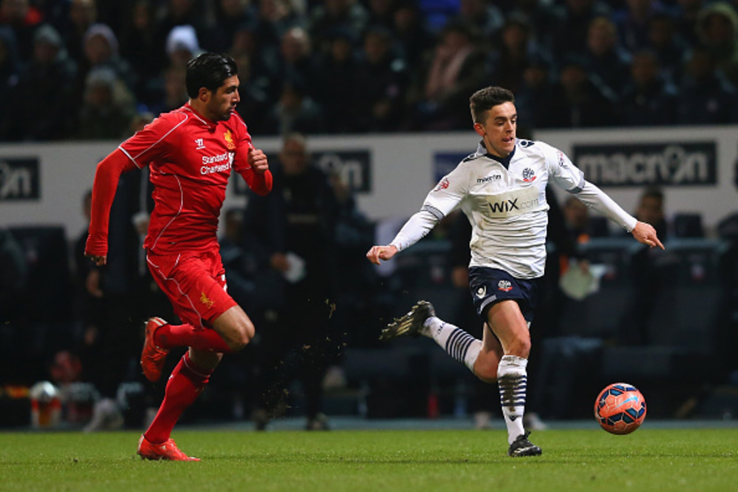 BOLTON, ENGLAND - FEBRUARY 04: Zach Clough of Bolton Wanderers breaks away from Emre Can of Liverpool during the FA Cup Fourth round replay between Bolton Wanderers and Liverpool at Macron Stadium on February 4, 2015 in Bolton, England. (Photo by Alex L BOLTON, ENGLAND - FEBRUARY 04: Zach Clough of Bolton Wanderers breaks away from Emre Can of Liverpool during the FA Cup Fourth round replay between Bolton Wanderers and Liverpool at Macron Stadium on February 4, 2015 in Bolton, England. (Photo by Alex L