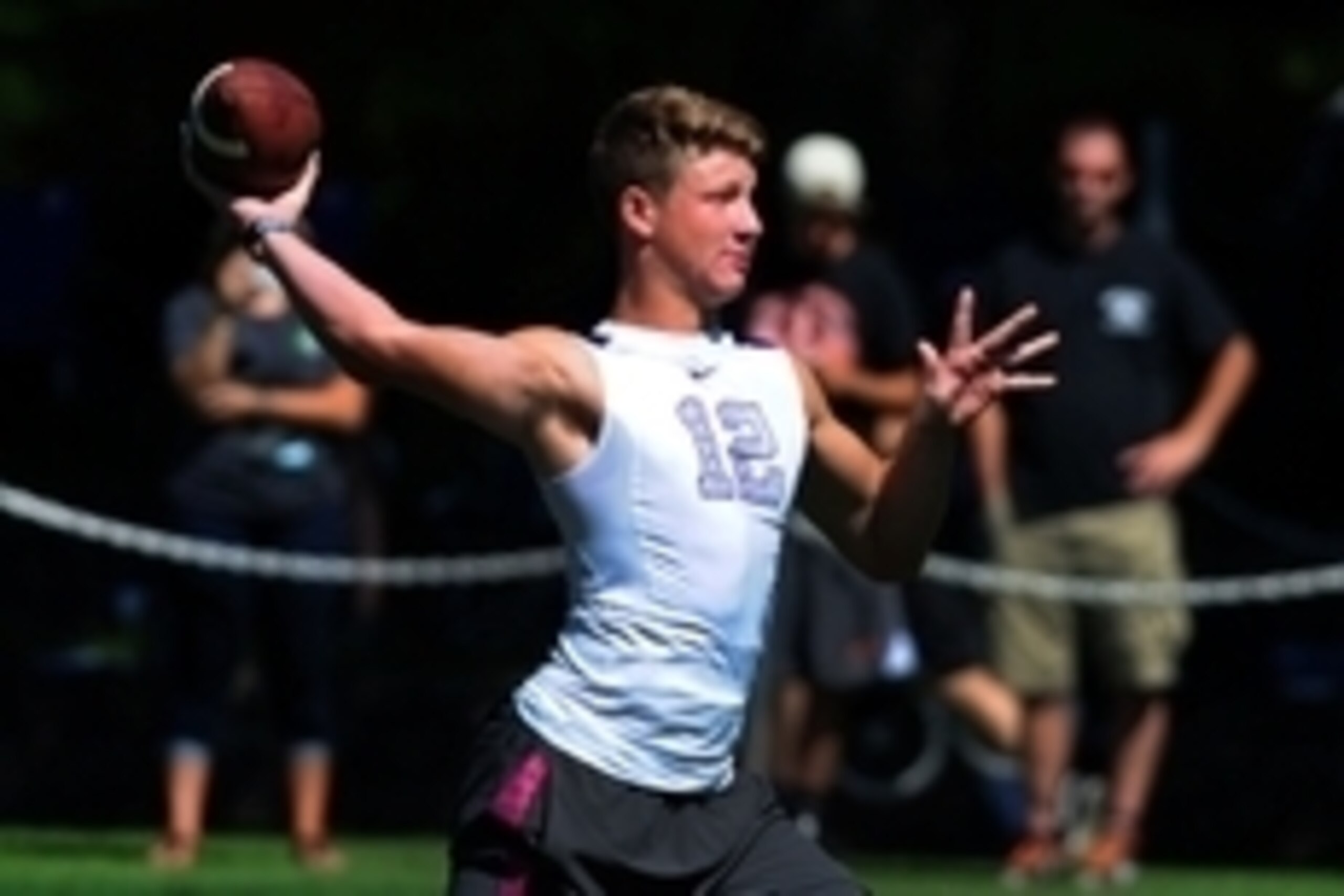 Jul 10, 2014; Beaverton, OR, USA; Apocalypse quarterback Blake Barnett (12) passes the ball during Nike Football ' The Opening' at Nike World Headquarters.  Mandatory Credit: Steve Dykes-USA TODAY Sports