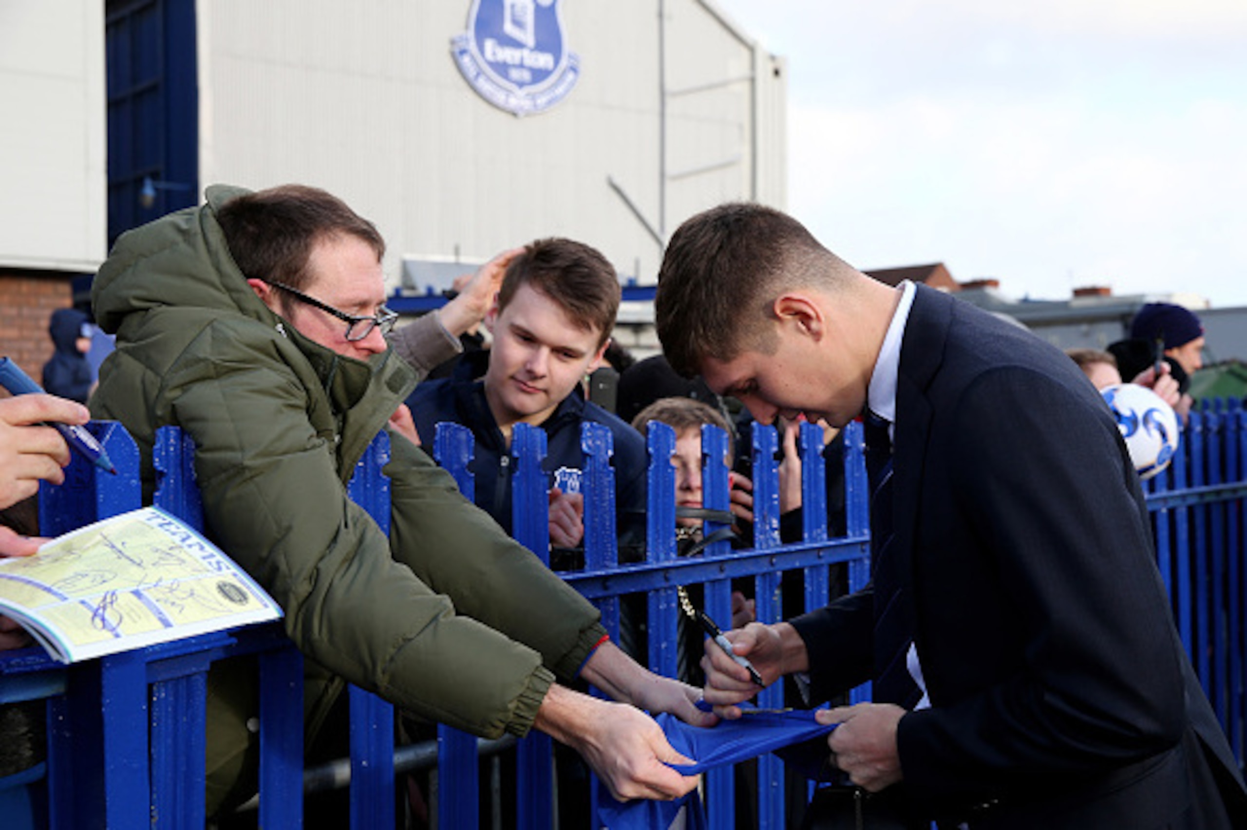 LIVERPOOL, ENGLAND - JANUARY 10:  John Stones of Everton signs autographs as he arrives at the stadium prior to kickoff during the Barclays Premier League match between Everton and Manchester City at Goodison Park on January 10, 2015 in Liverpool, England